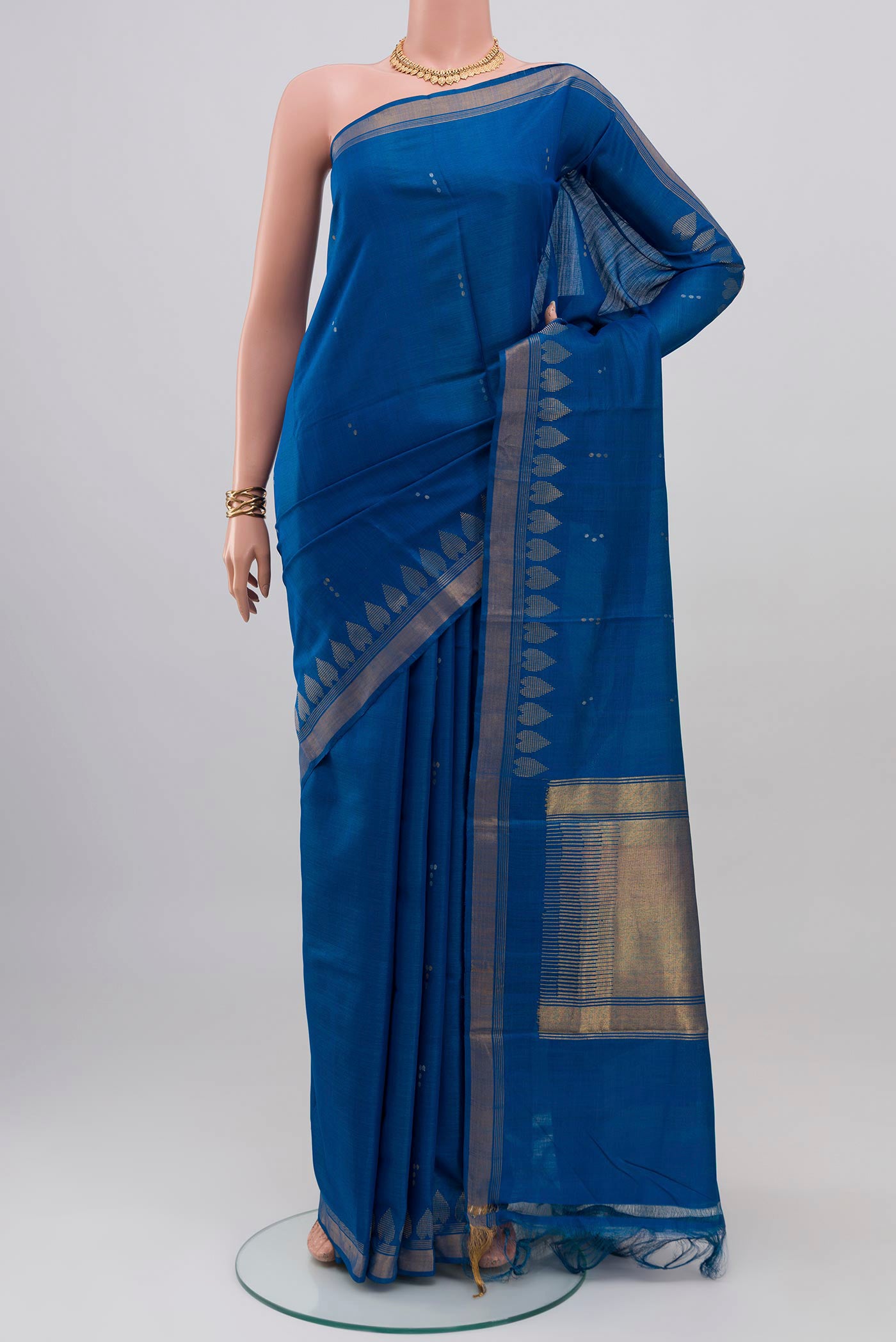 Blue Tussar Silk Saree with Zari Butta on the body and Zari Border.  displayed on a mannequin
