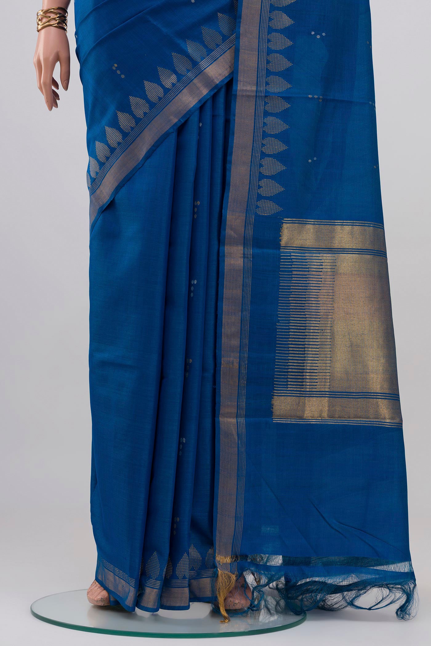 Pleats and pallu of Blue Tussar Silk Saree with Zari Butta on the body and Zari Border. 