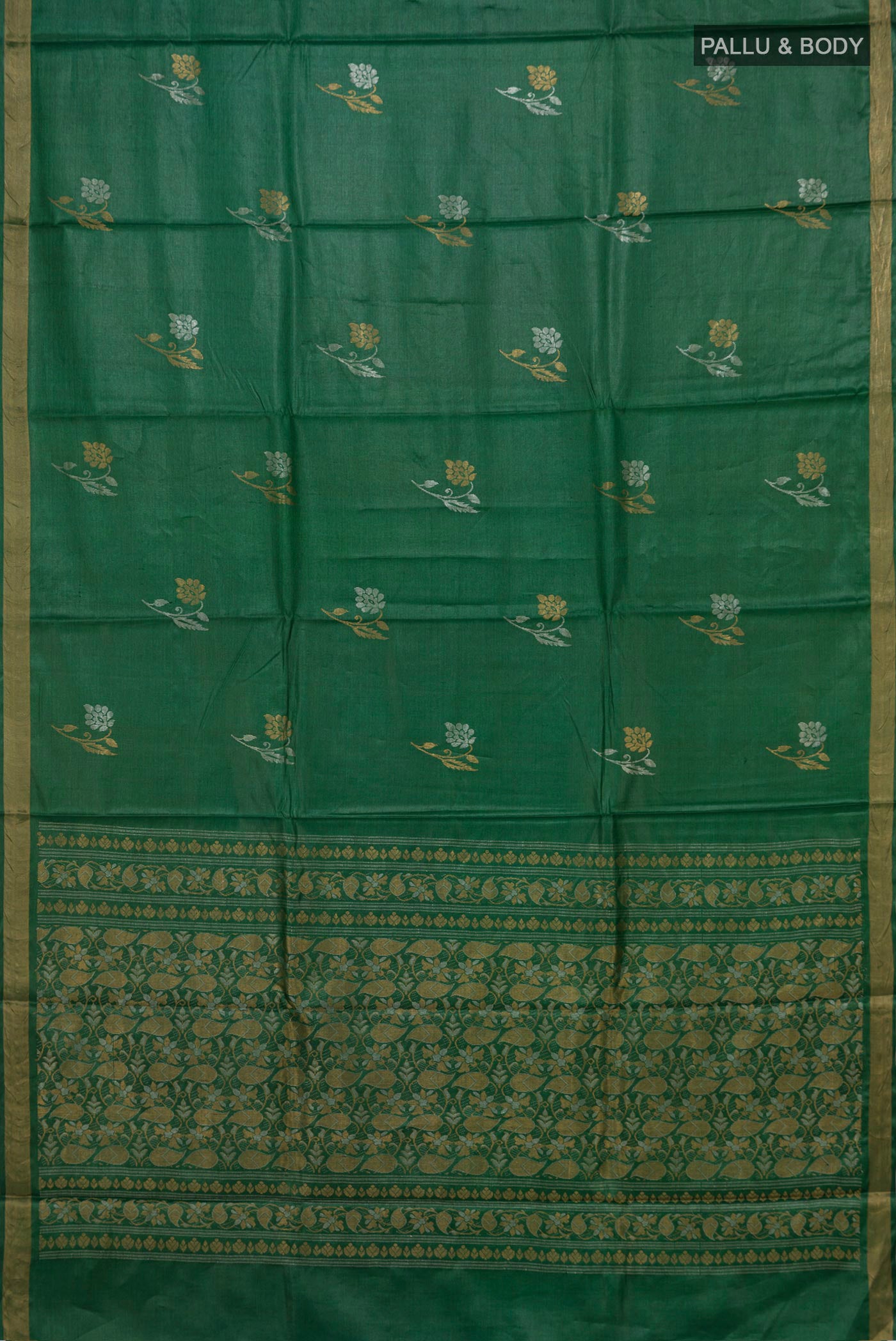 Flat view of Green Tussar Silk Saree with Zari Butta on the body and Zari Border. 