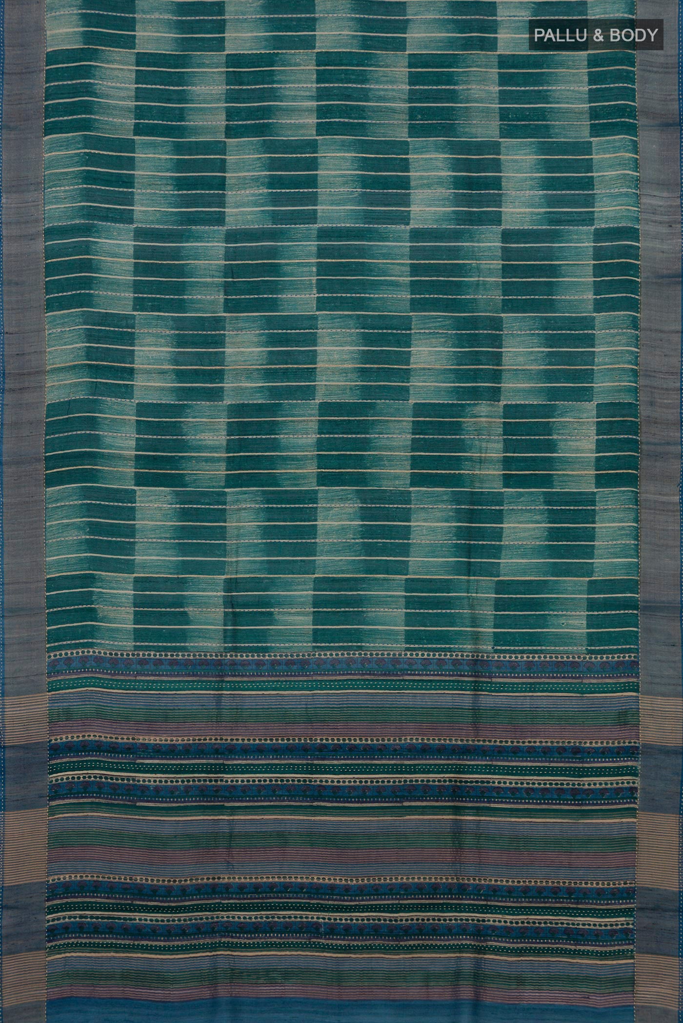 Flat view of Green Tussar Silk Saree with Printed design on the body and Zari Border. 