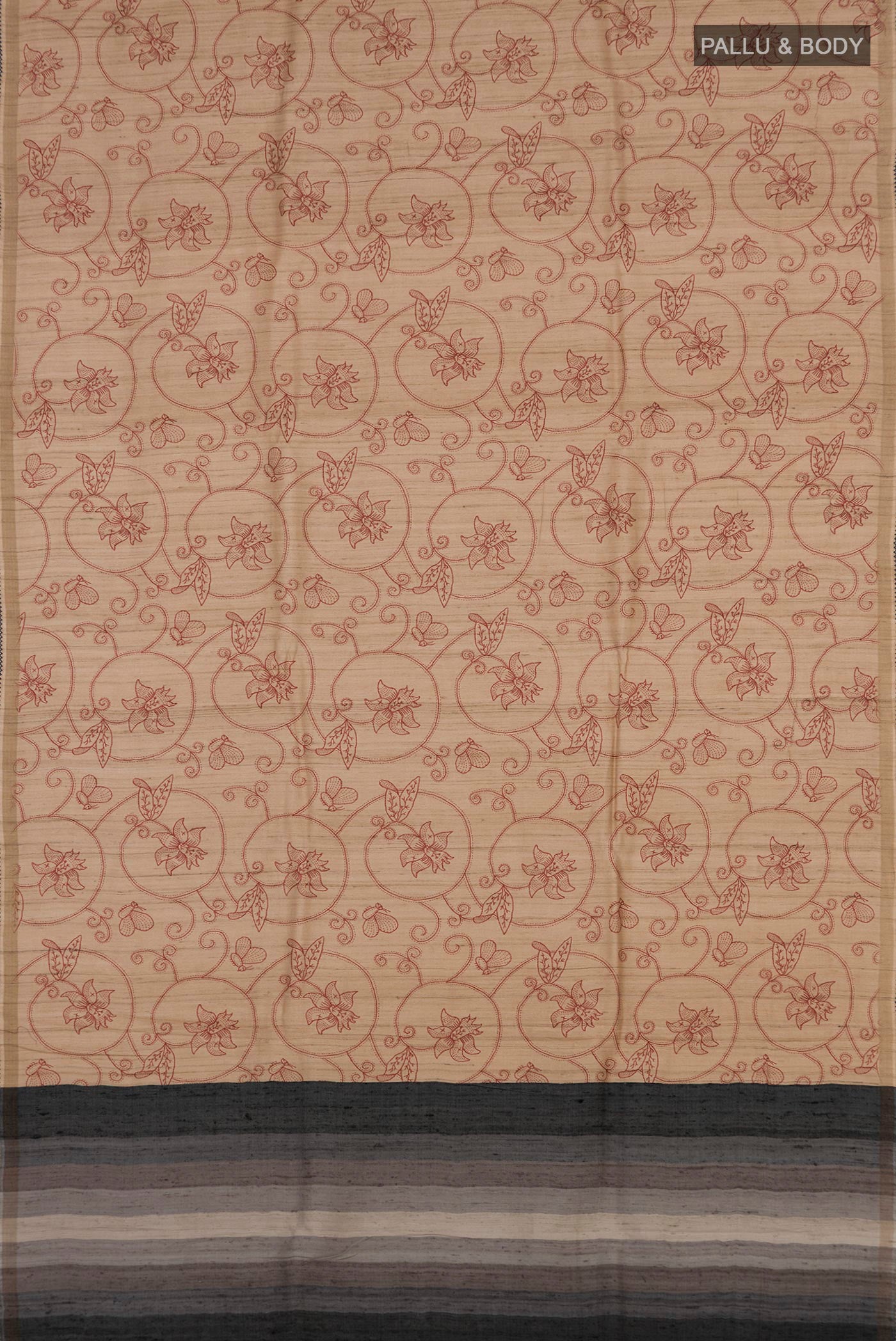Flat view of Sandal Tussar Silk Saree with Printed design on the body and Thin Zari Line. 