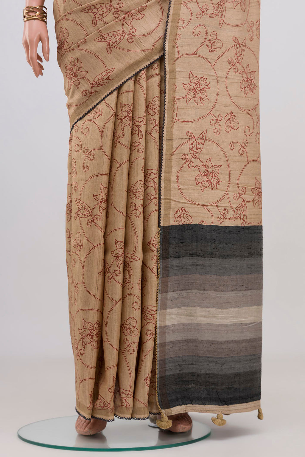 Pleats and pallu of Sandal Tussar Silk Saree with Printed design on the body and Thin Zari Line. 