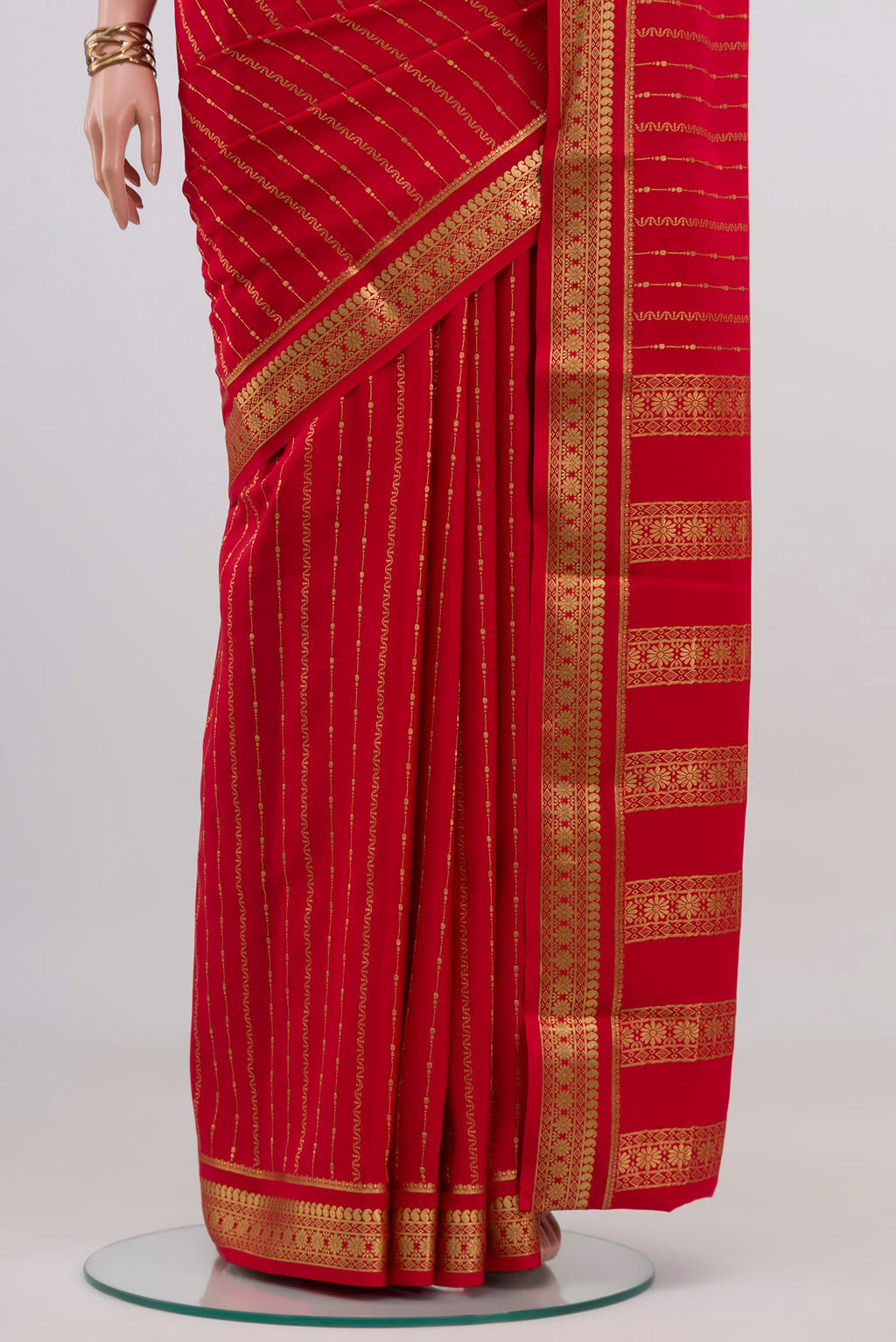 Pleats and pallu of Red Mysore Crepe Saree with Stripes on the body and Zari Border. 