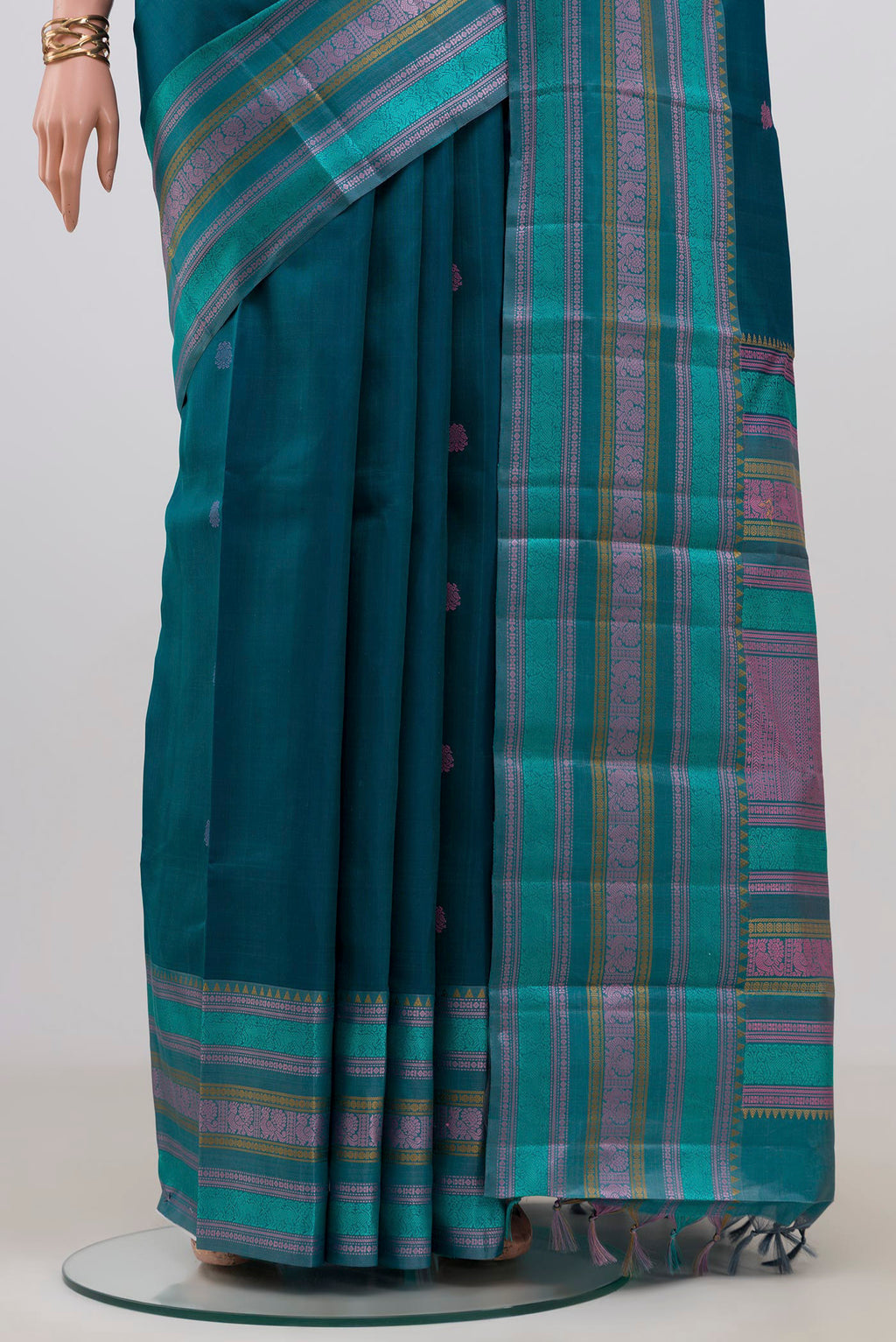 Pleats and pallu of Blue Kanchipuram Silk Saree with Thread Butta on the body and Thread Border. 