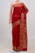 Maroon Baluchari Silk Saree with Zari Butta on the body and Zari Border.  displayed on a mannequin