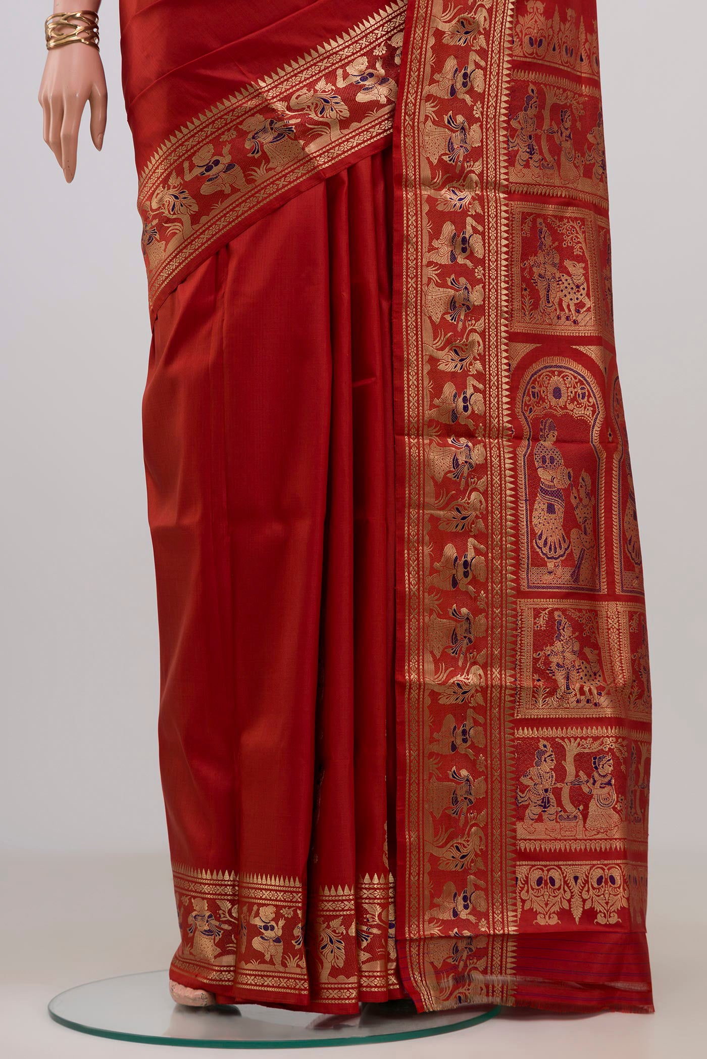 Pleats and pallu of Maroon Baluchari Silk Saree with Zari Butta on the body and Zari Border. 