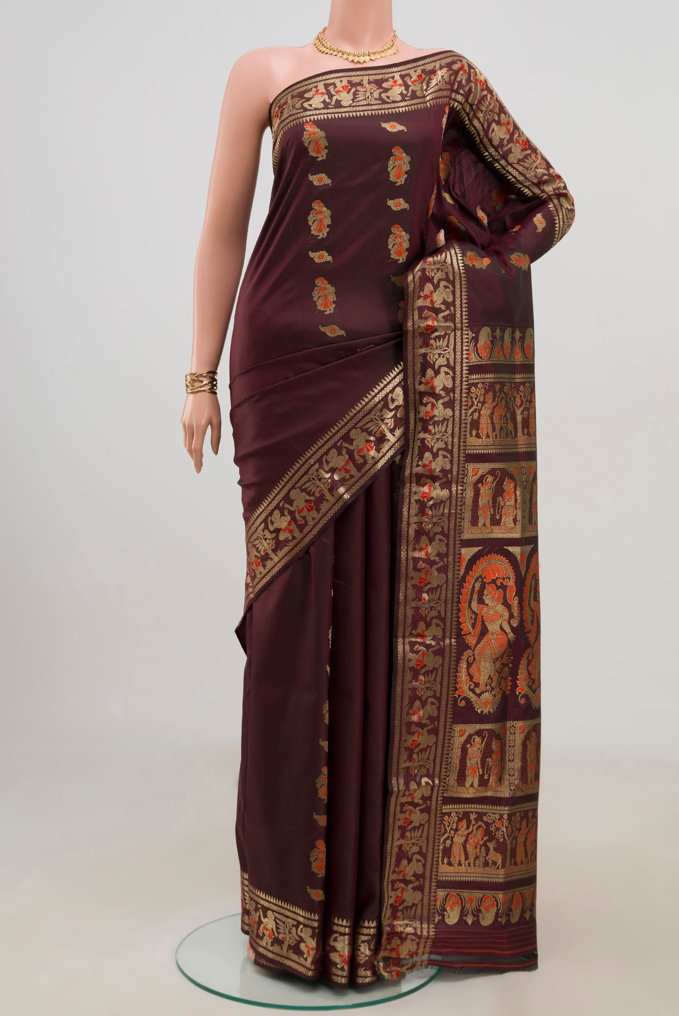 Coffee Brown Baluchari Silk Saree with Zari Butta on the body and Zari Border.  displayed on a mannequin