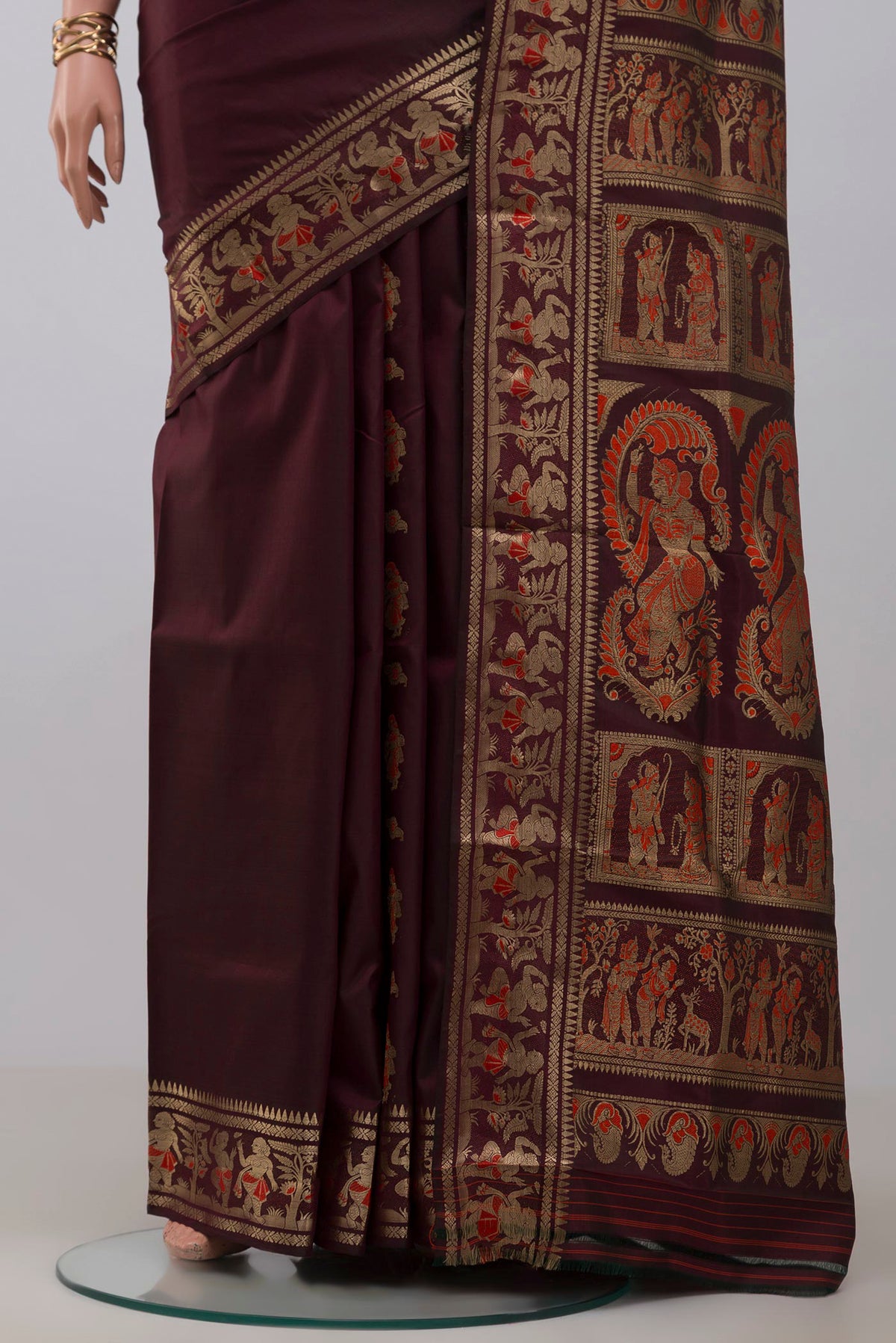 Pleats and pallu of Coffee Brown Baluchari Silk Saree with Zari And Thread Butta on the body and Zari Border. 