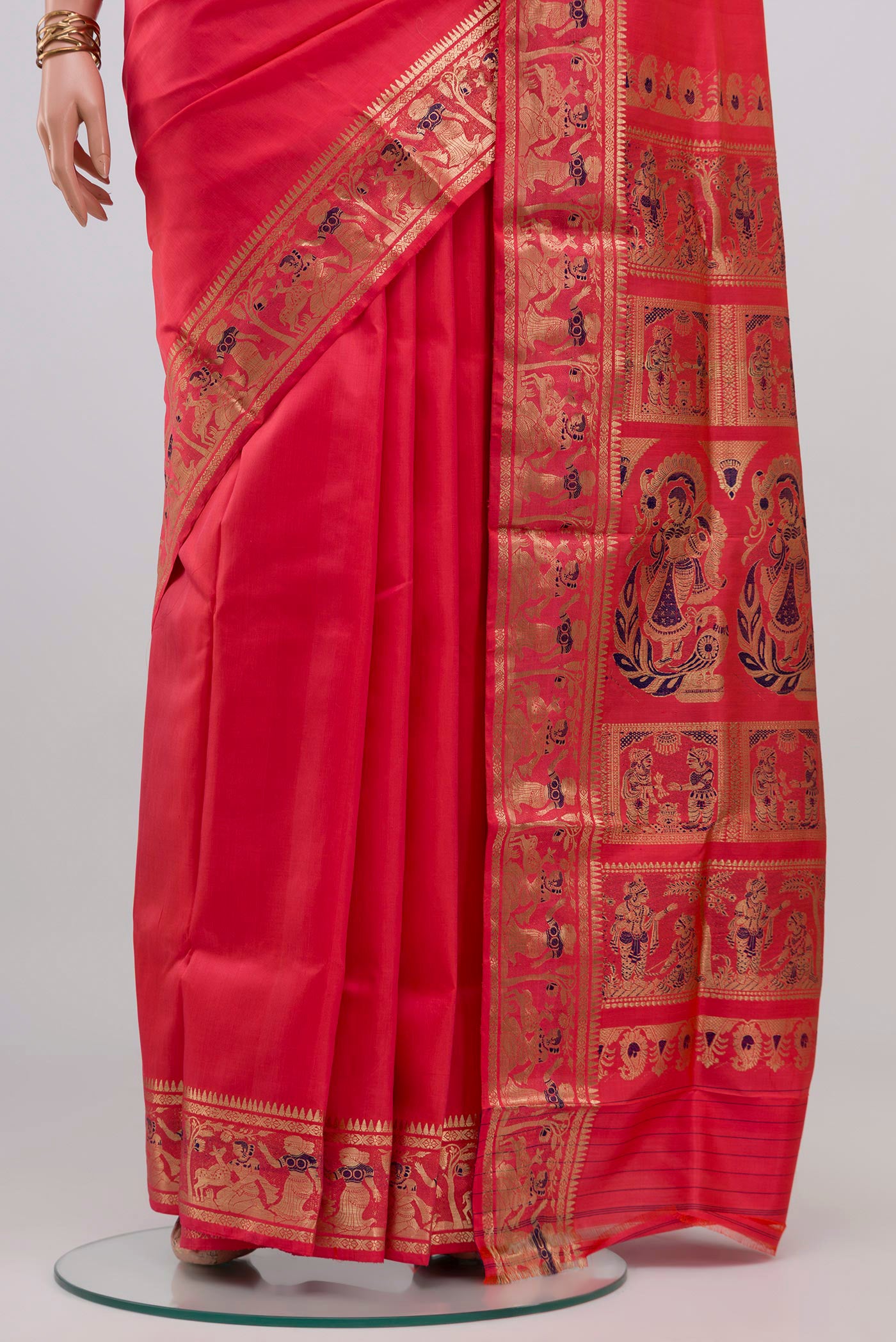 Pleats and pallu of Coral Baluchari Silk Saree with Zari And Thread Butta on the body and Zari Border. 
