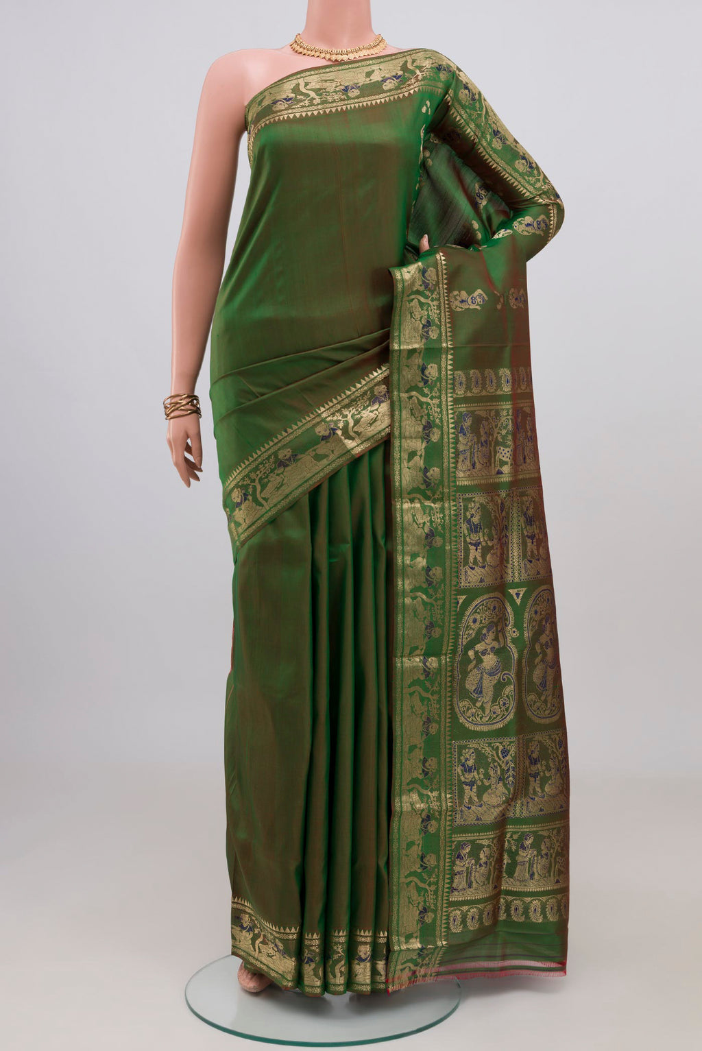 Green Baluchari Silk Saree with Plain Body and Zari Border.  displayed on a mannequin