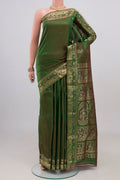 Green Baluchari Silk Saree with Plain Body and Zari Border.  displayed on a mannequin