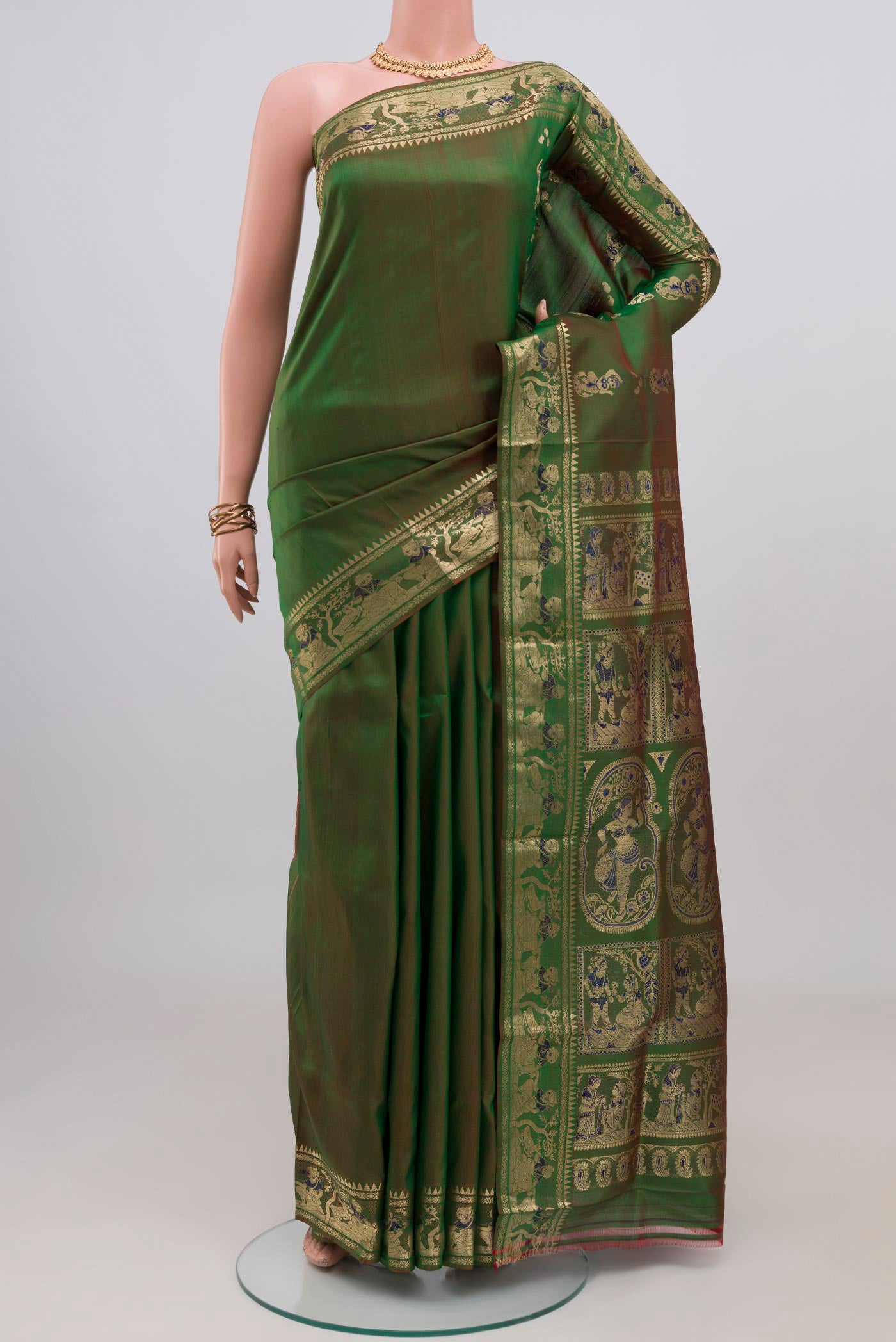 Green Baluchari Silk Saree with Plain Body and Zari Border.  displayed on a mannequin