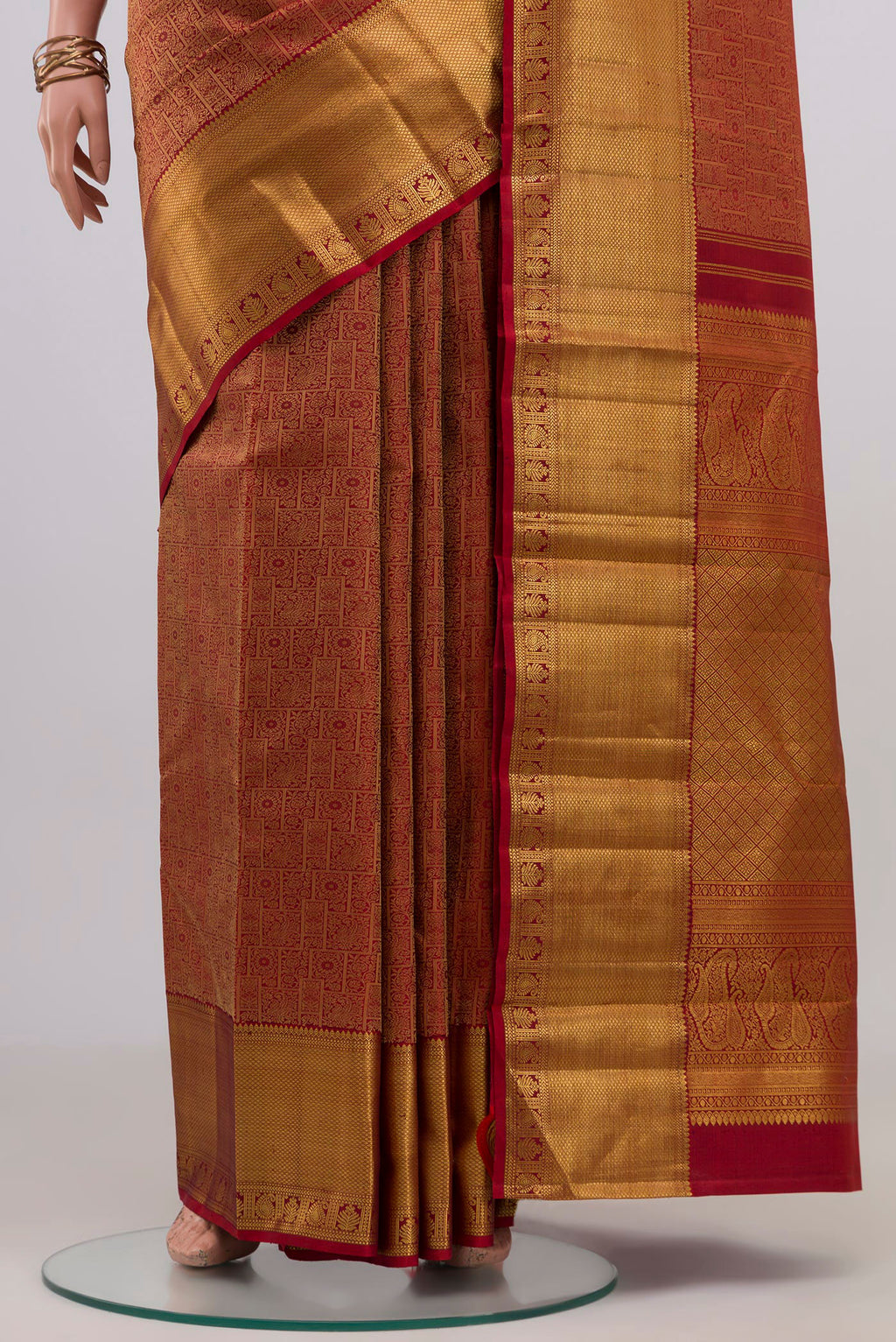 Pleats and pallu of Maroon Kanjivaram Silk Saree with Zari Brocade on the body and Zari Border. 