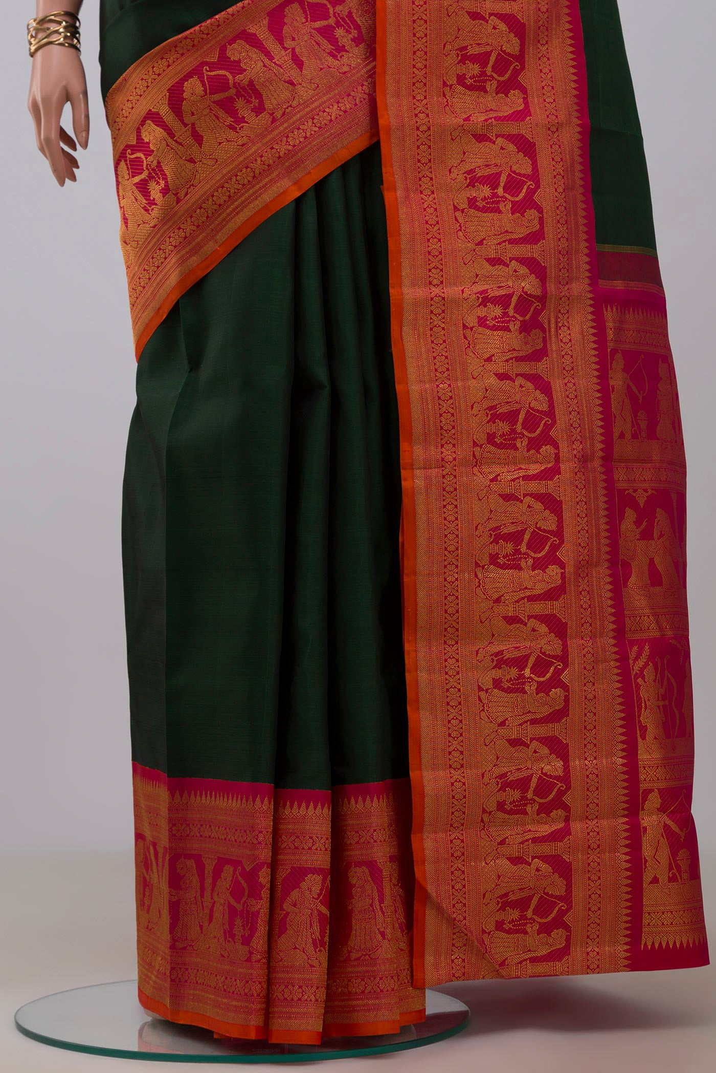 Pleats and pallu of Pure Silk Pure Zari Green Kanchipuram Saree with Plain Body and Fancy Border. 