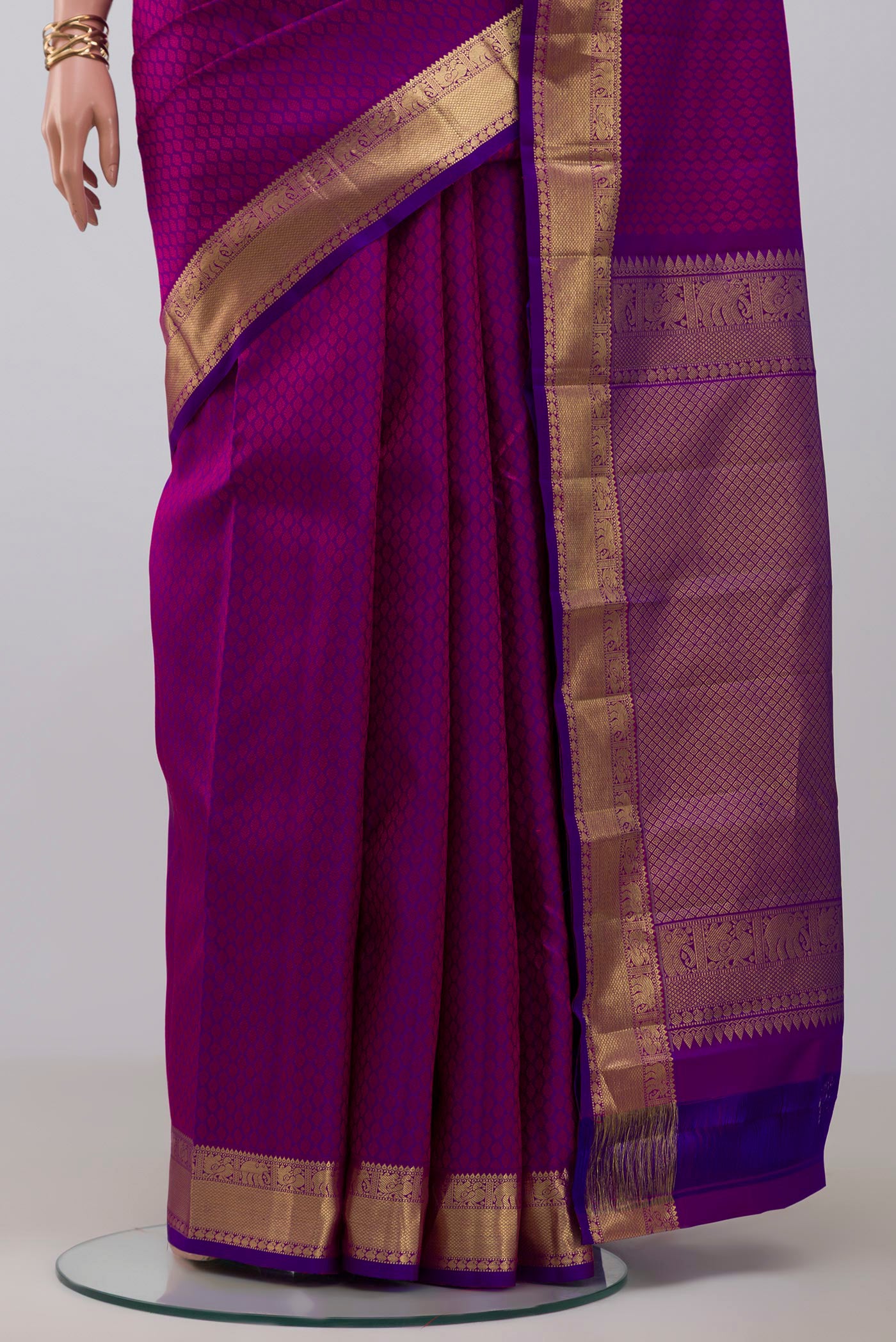 Pleats and pallu of Purple Kanjivaram Silk Saree with Jacquard design on the body and Zari Border. 
