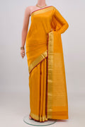 Yellow Kanjivaram Silk Saree with Jacquard design on the body and Zari Border.  displayed on a mannequin