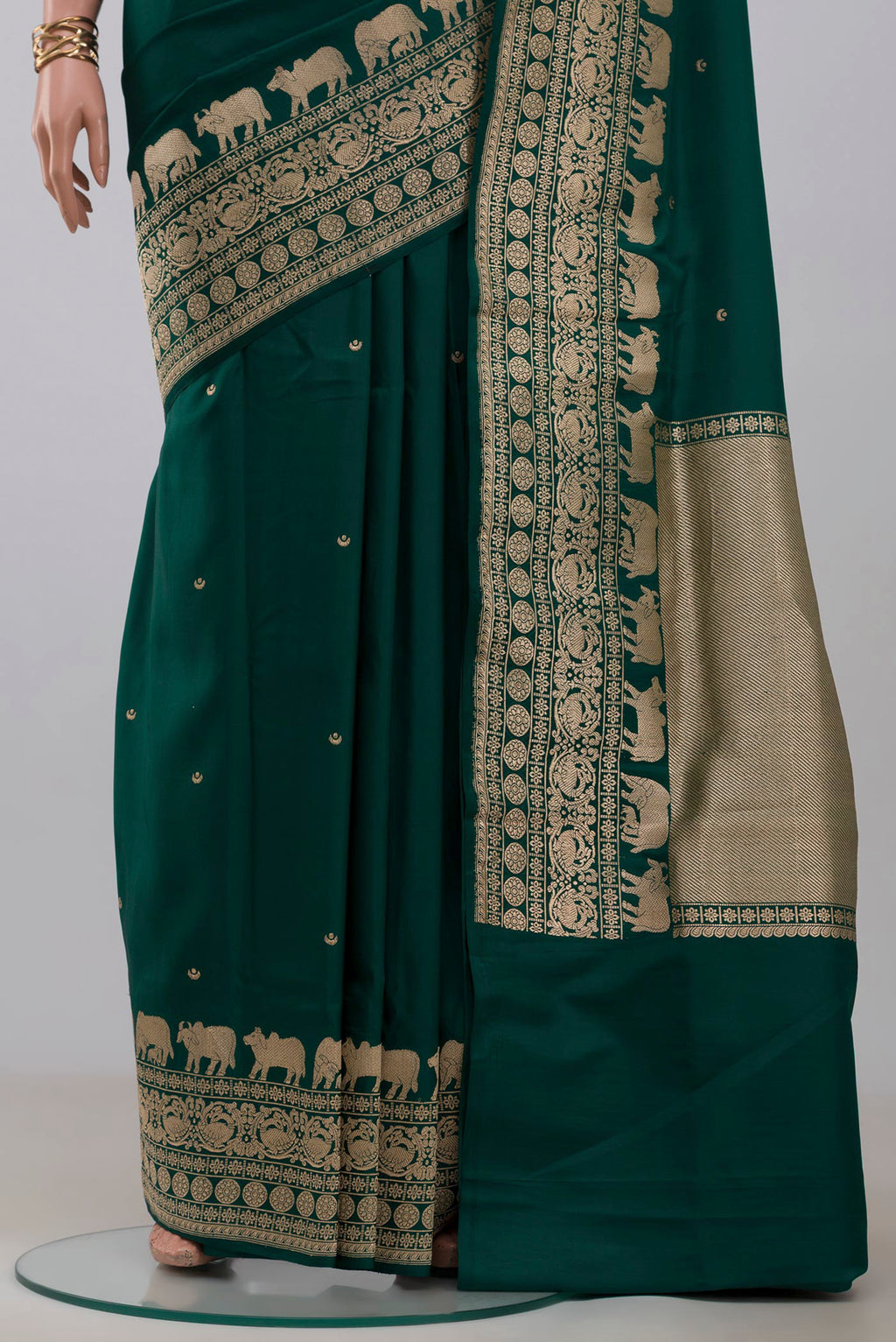 Pleats and pallu of Green Banarasi Saree with Zari Butta on the body and Fancy Border. 