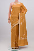 Caramel Banarasi Silk Saree with Plain Body and Zari Border.  displayed on a mannequin