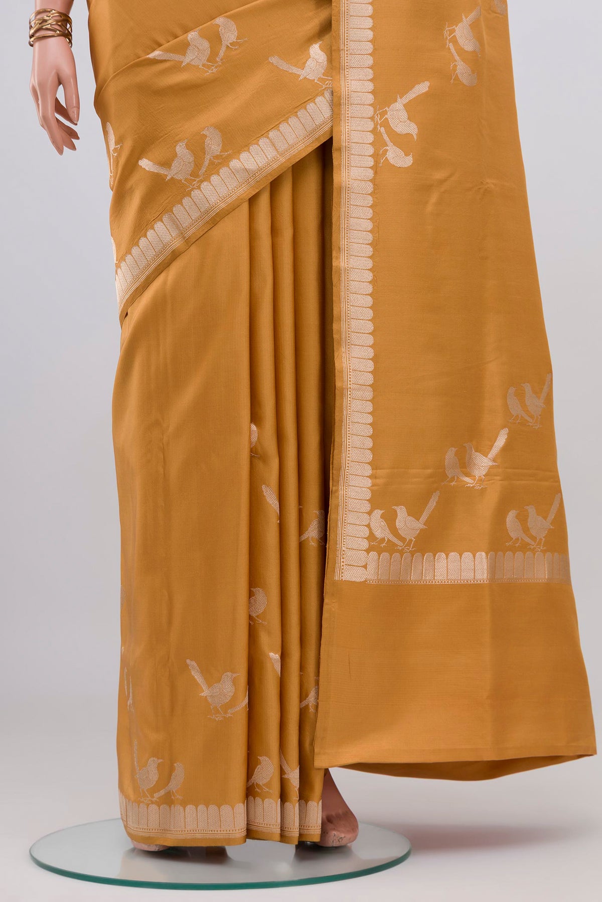 Pleats and pallu of Caramel Banarasi Silk Saree with Plain Body and Zari Border. 