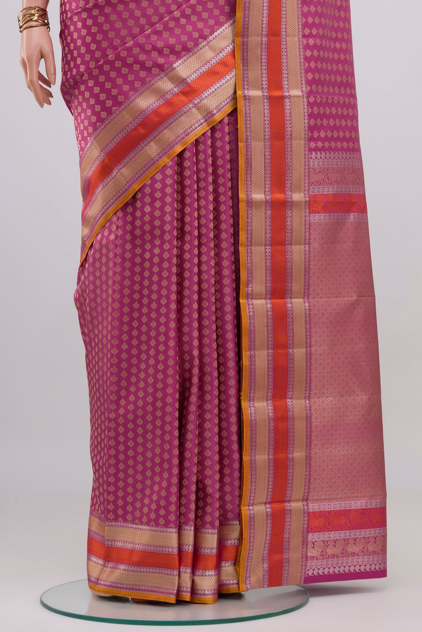 Pleats and pallu of Pink Kanchipuram Silk Saree with Thread Butta on the body and Thread Border. 