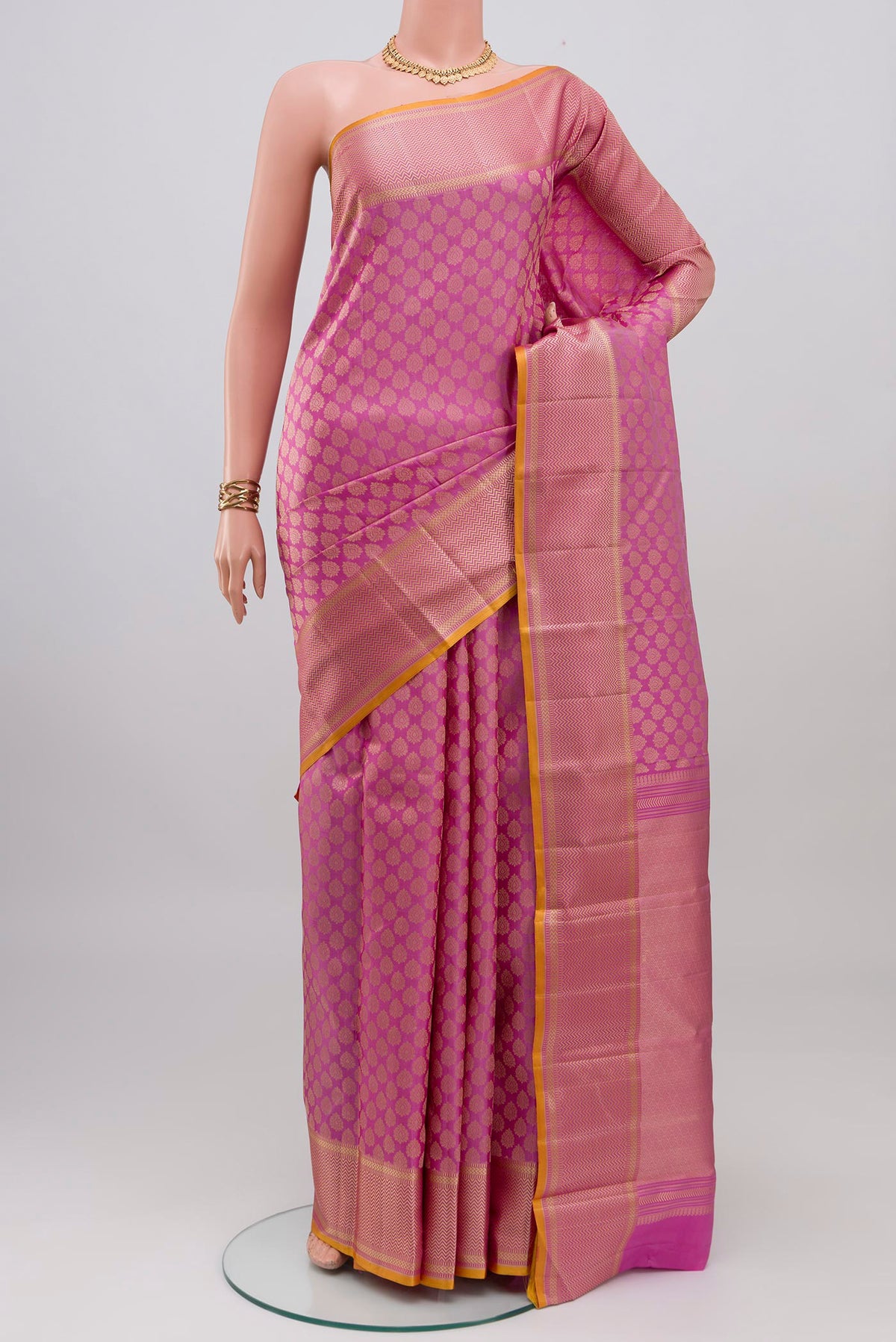 Lavender Kanchipuram Silk Saree with Jacquard design on the body and Thread Border.  displayed on a mannequin