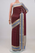 Burgundy Mysore Crepe Saree with Checked design on the body and Zari Border.  displayed on a mannequin