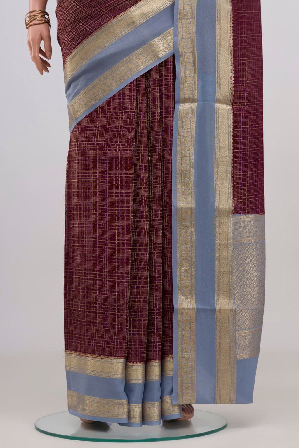 Pleats and pallu of Burgundy Mysore Crepe Saree with Checked design on the body and Zari Border. 