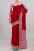 Red Mysore Crepe Saree with Zari Butta on the body and Zari Border.  displayed on a mannequin