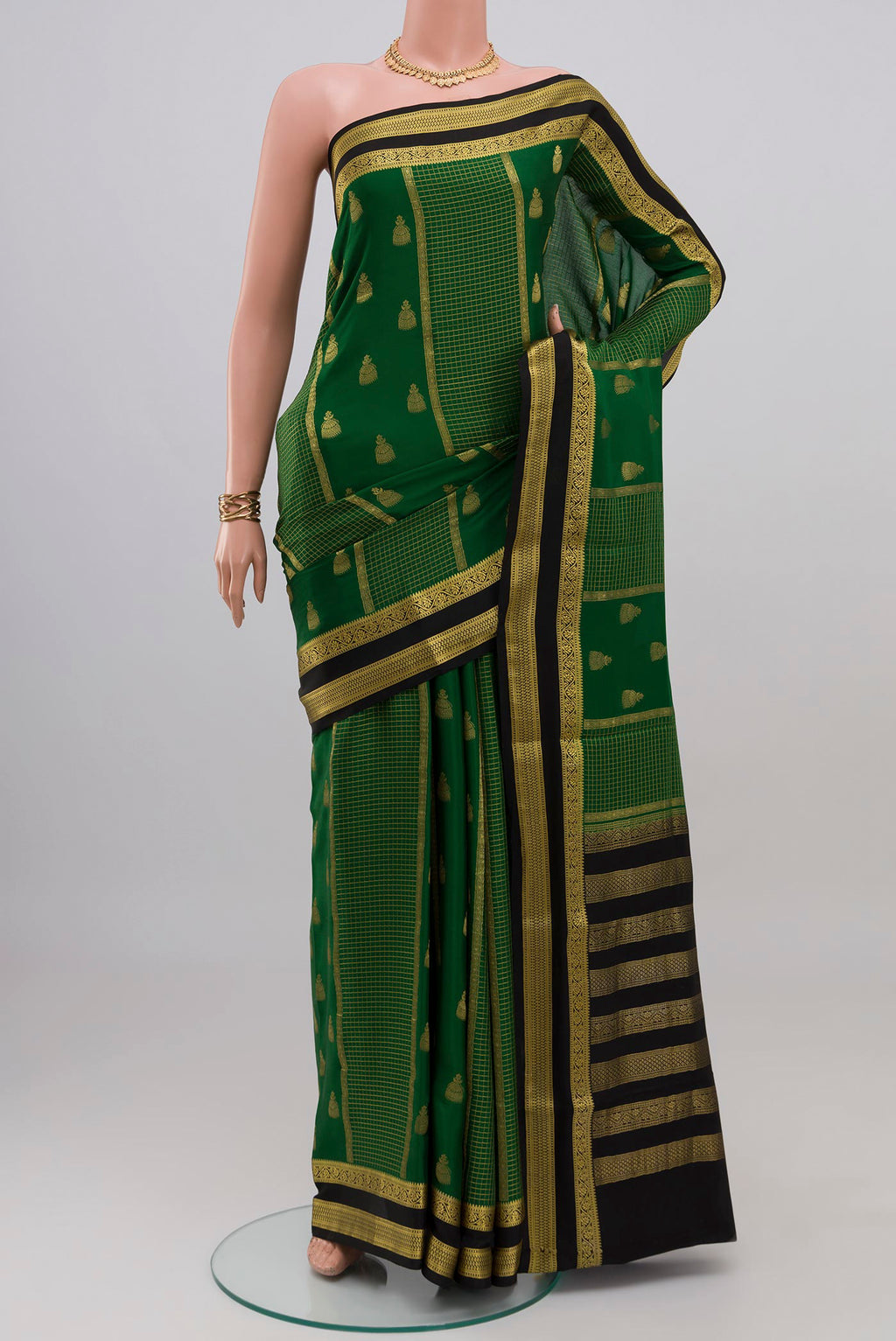 Green Mysore Crepe Saree with Stripes on the body and Zari Border.  displayed on a mannequin