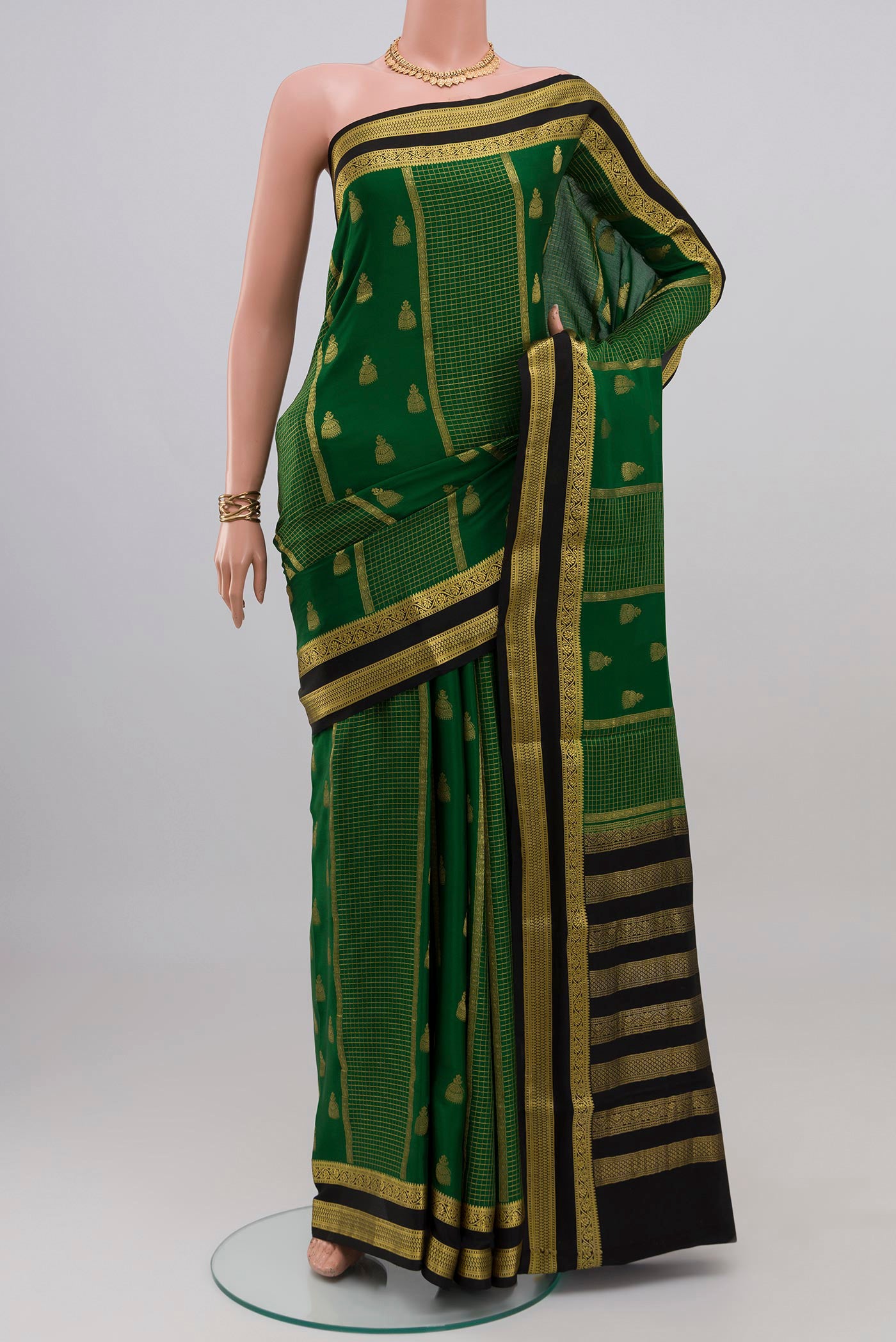Green Mysore Crepe Saree with Stripes on the body and Zari Border.  displayed on a mannequin