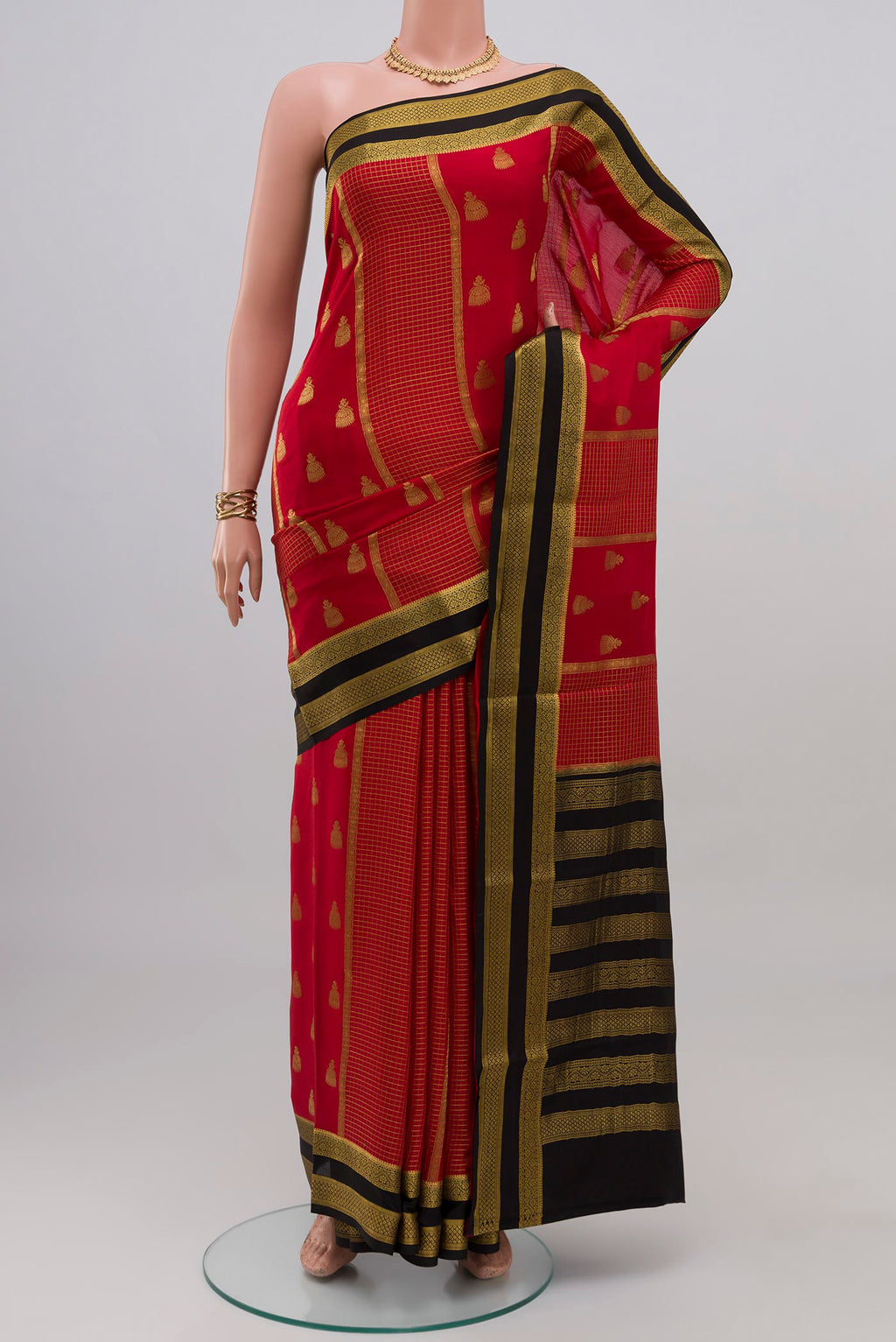 Red Mysore Crepe Saree with Stripes on the body and Zari Border.  displayed on a mannequin