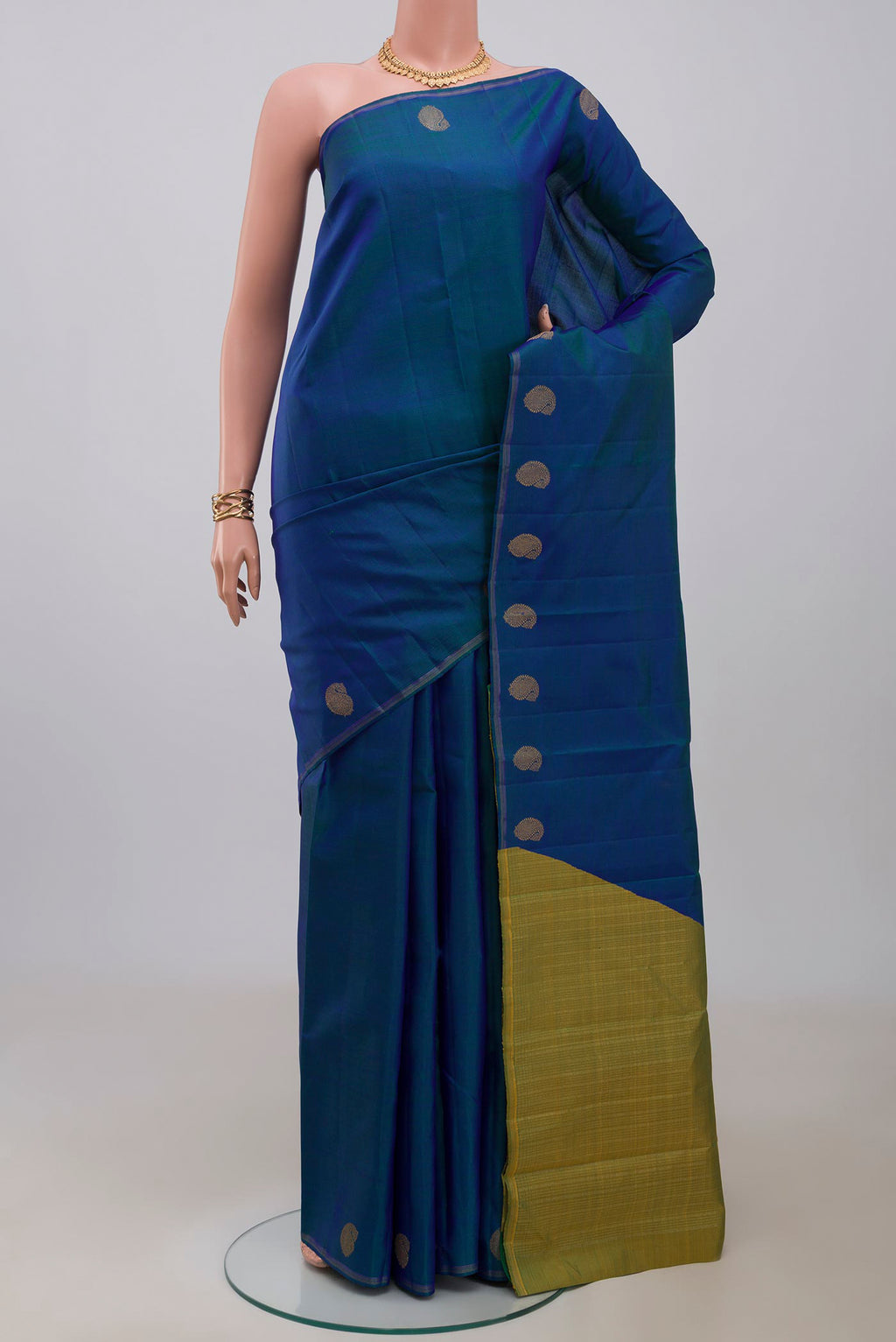 Pure Silk Pure Zari Blue Kanjivaram Saree with Plain Body and Thin Zari Line.  displayed on a mannequin