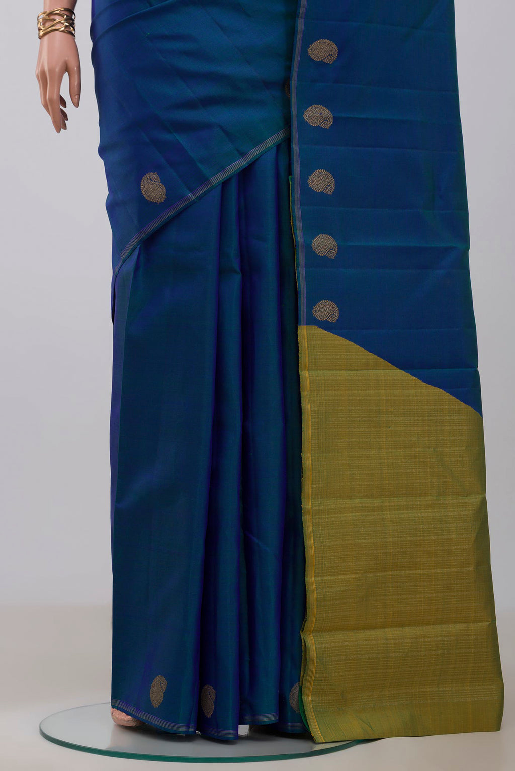 Pleats and pallu of Pure Silk Pure Zari Blue Kanjivaram Saree with Plain Body and Thin Zari Line. 