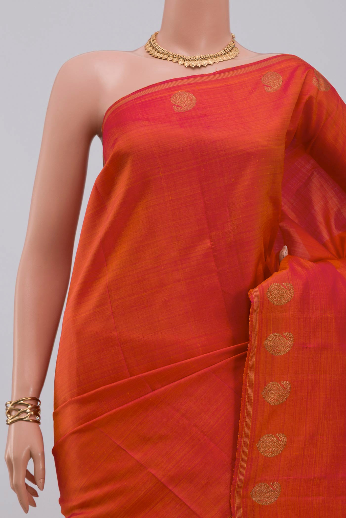 Border image of Pure Silk Pure Zari Orange Kanjivaram Saree with Fancy on the body and Thin Zari Line. 