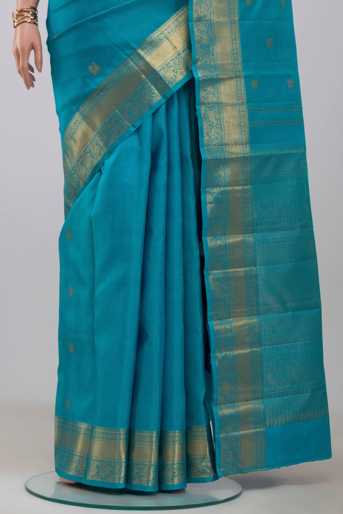 Pleats and pallu of Pure Silk Pure Zari Blue Kanjivaram Saree with Zari Butta on the body and Zari Border. 