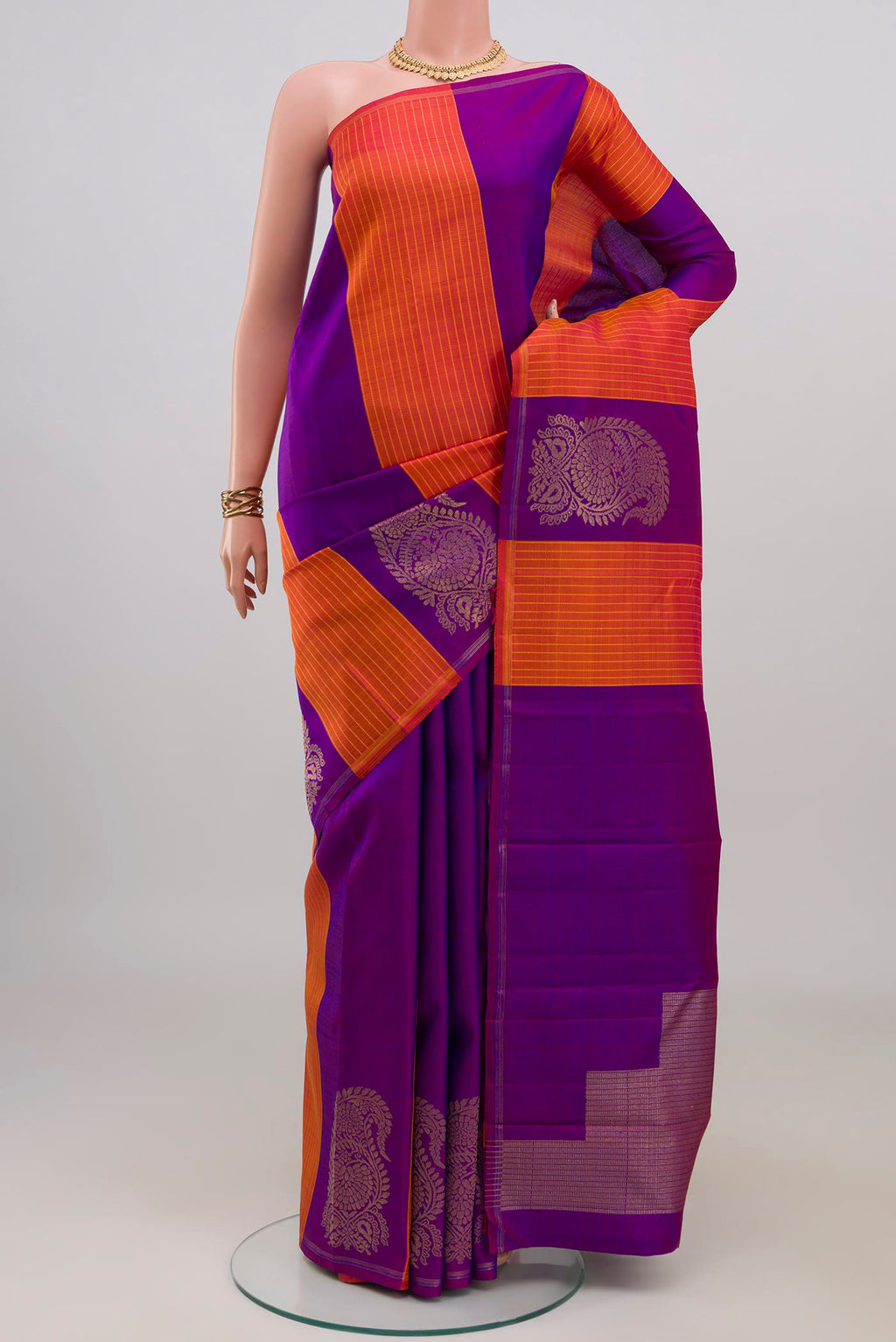 Pure Silk Pure Zari Multi Color Kanchipuram Saree with Stripes on the body and Thin Zari Line.  displayed on a mannequin