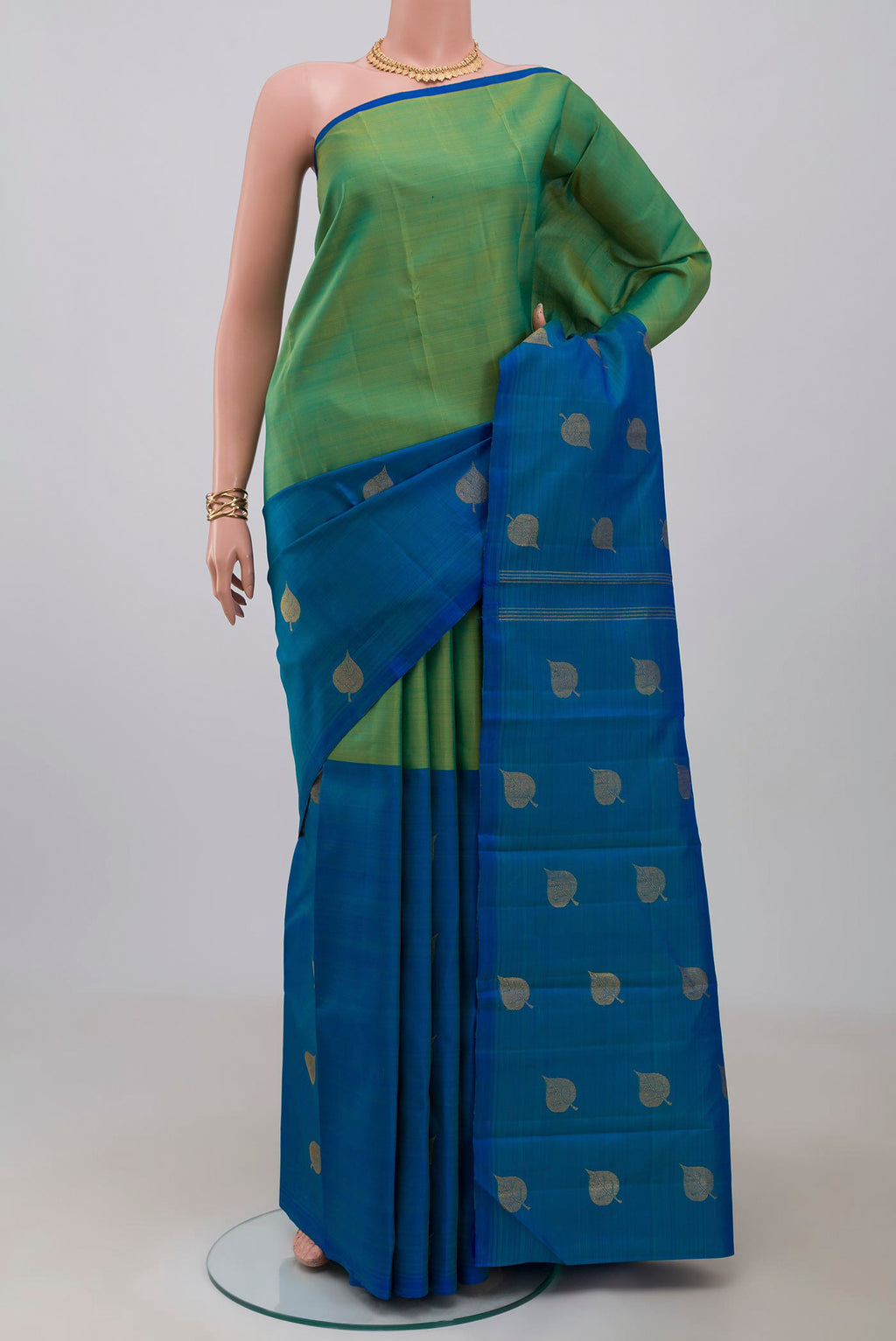 Pure Silk Pure Zari Multi Color Kanchipuram Saree with Half And Half on the body and Without Border.  displayed on a mannequin