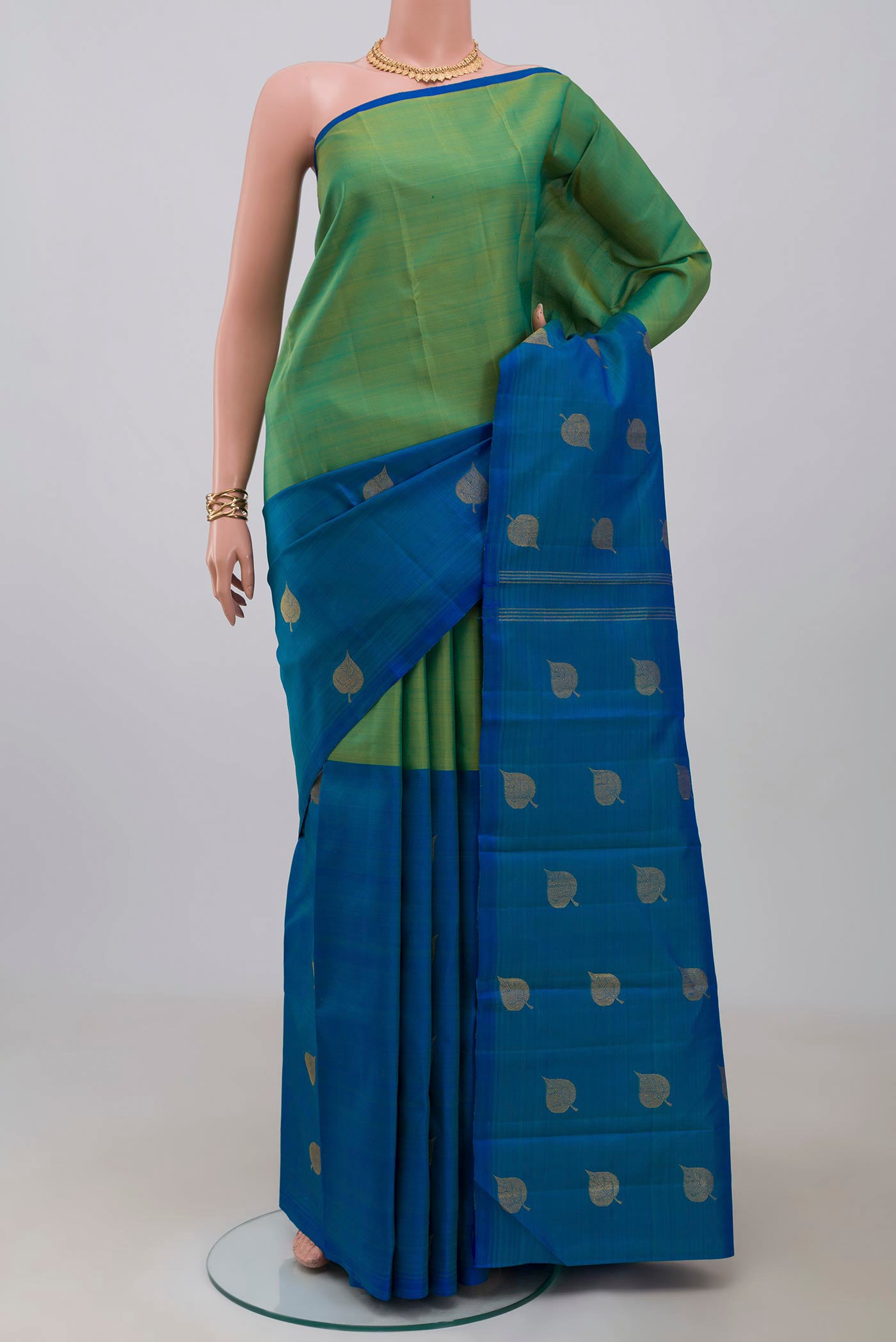 Pure Silk Pure Zari Multi Color Kanchipuram Saree with Half And Half on the body and Without Border.  displayed on a mannequin