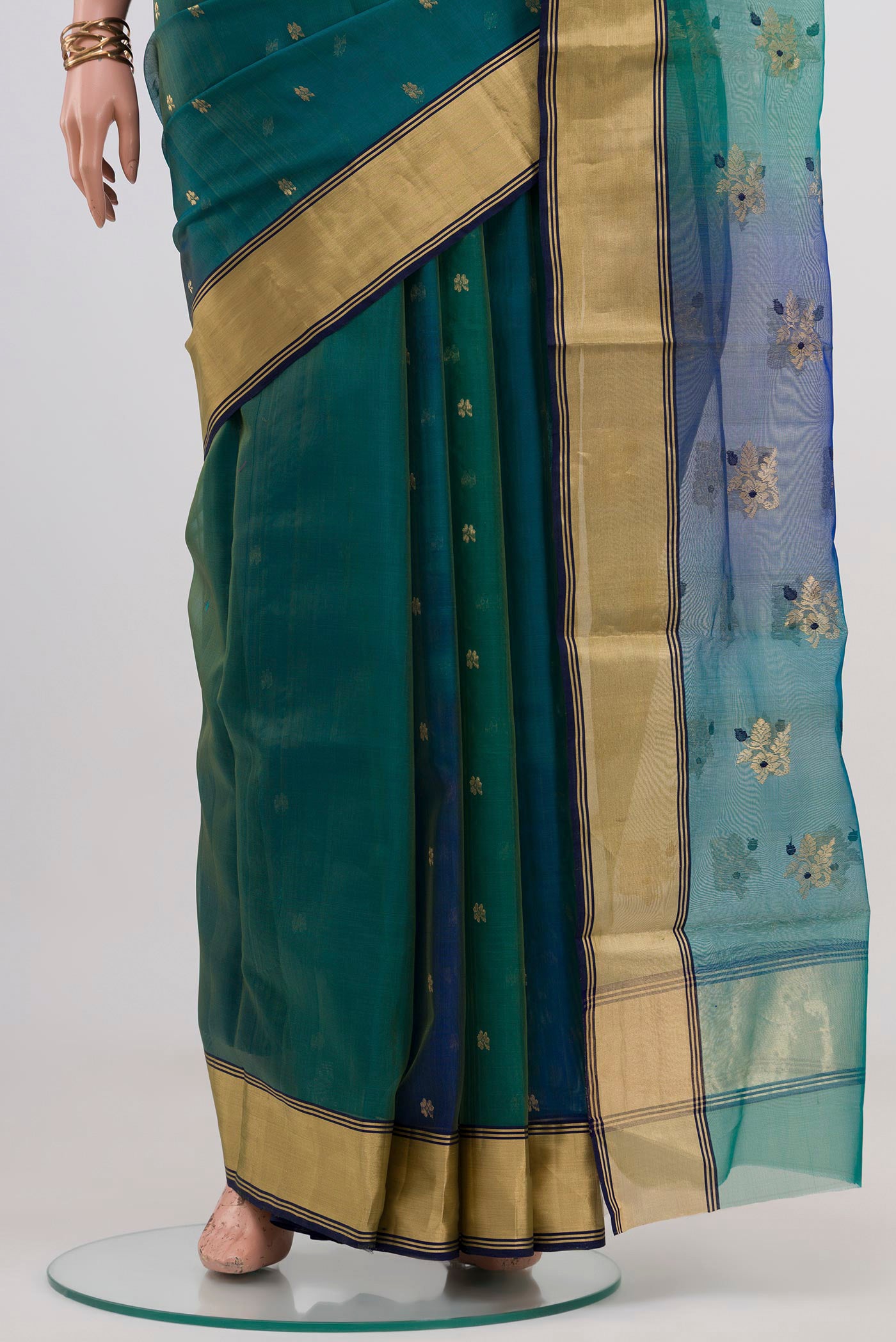 Pleats and pallu of Green Dual Tone Chanderi Silk Cotton Saree with Zari Butta on the body and Zari Border. 