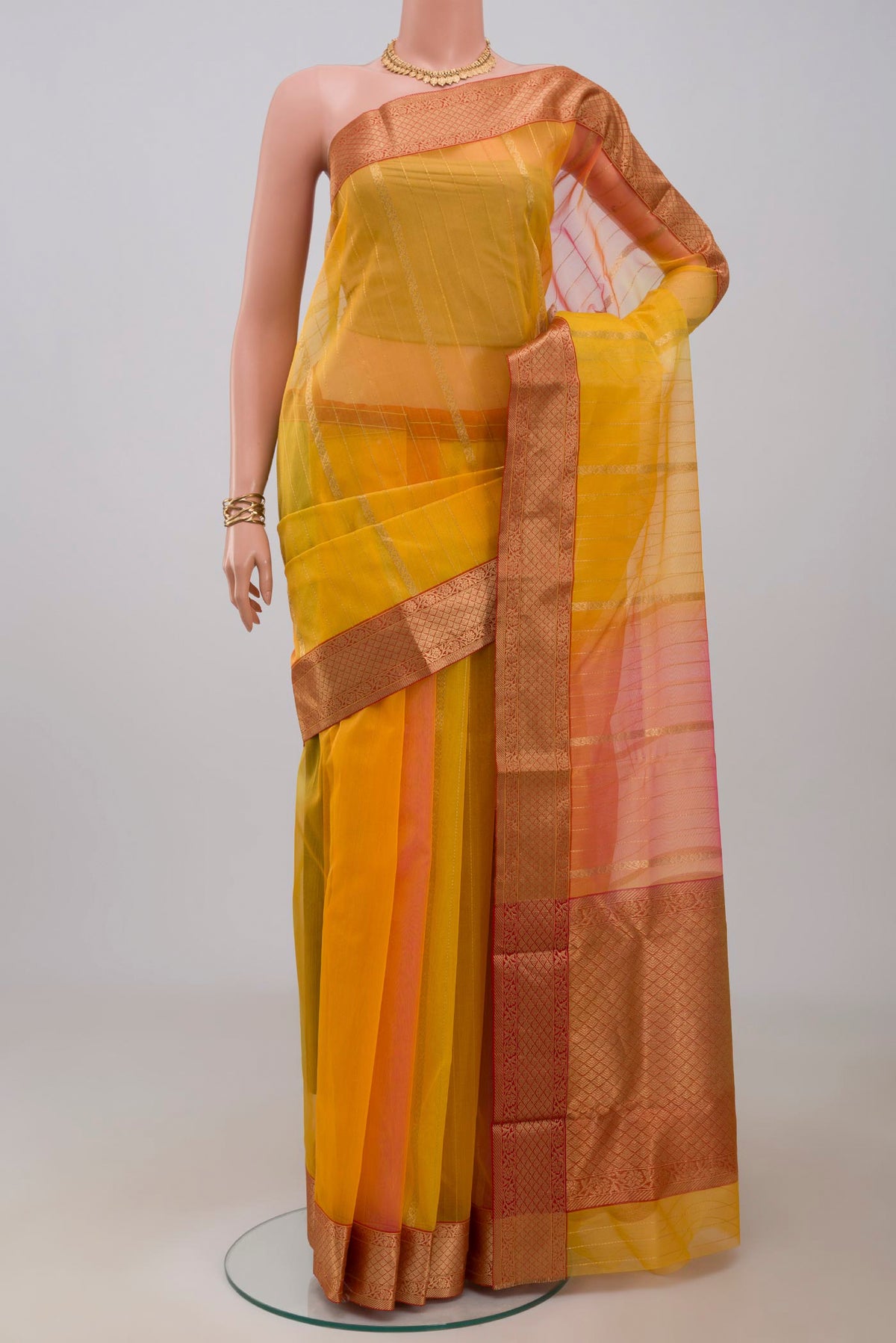 Multi Color Chanderi Silk Cotton Saree with Fancy on the body and Zari Border.  displayed on a mannequin