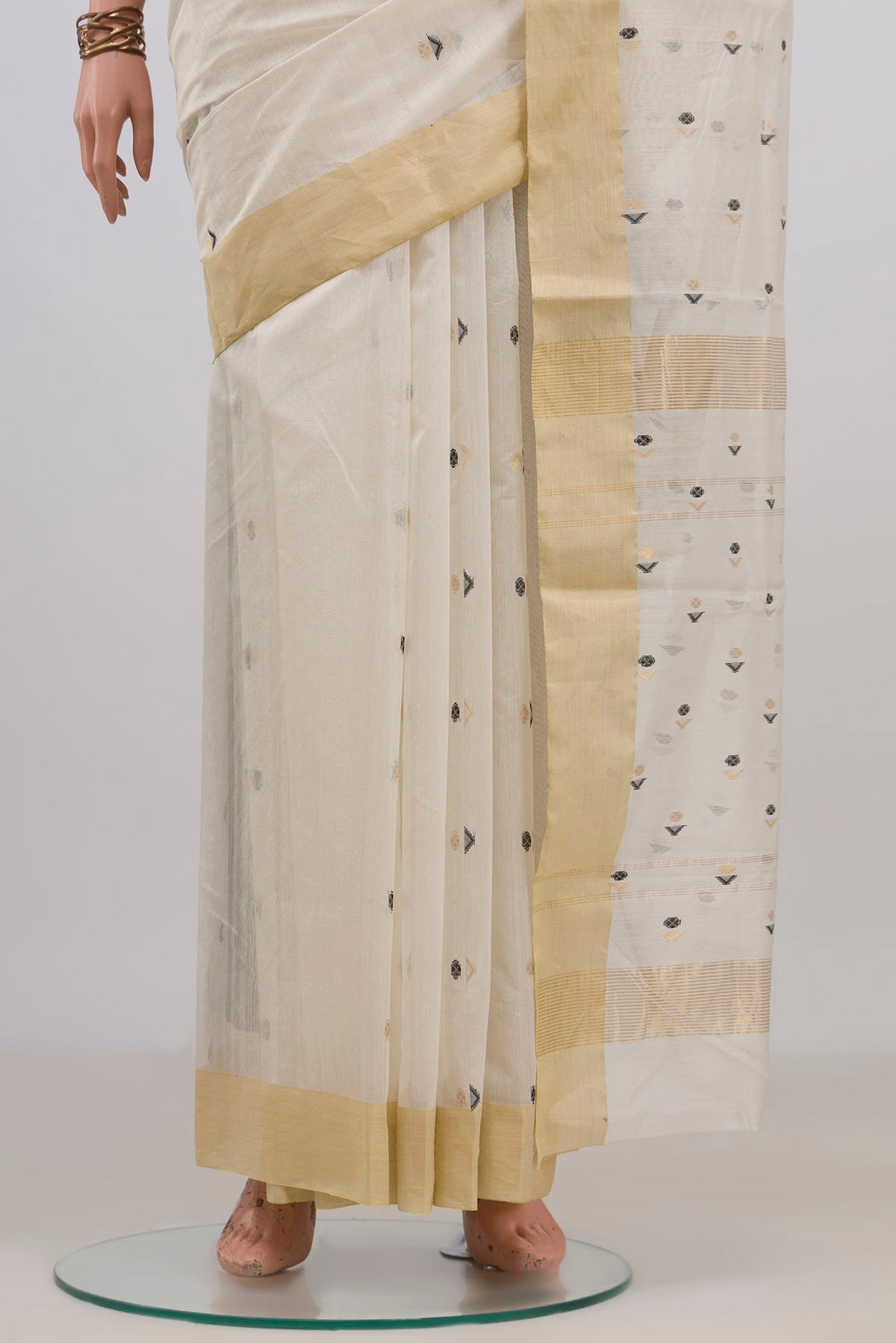 Pleats and pallu of Off White Chanderi Cotton Saree with Zari Butta on the body and Zari Border. 