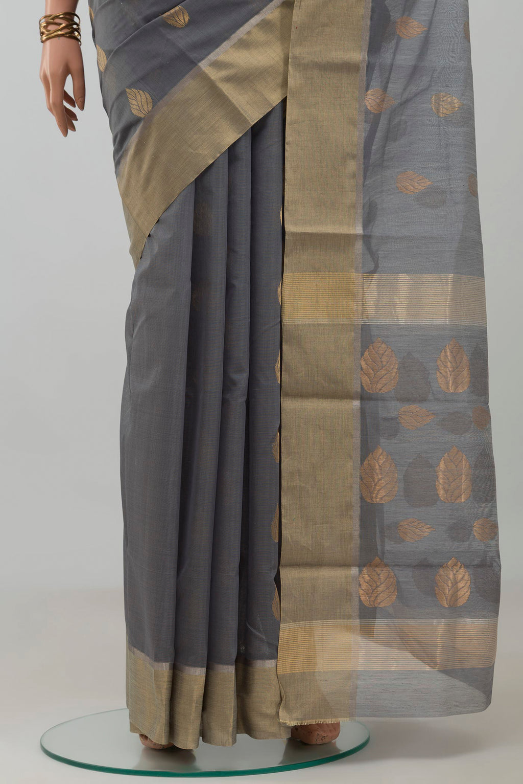 Pleats and pallu of Grey Chanderi Silk Cotton Saree with Zari Butta on the body and Zari Border. 