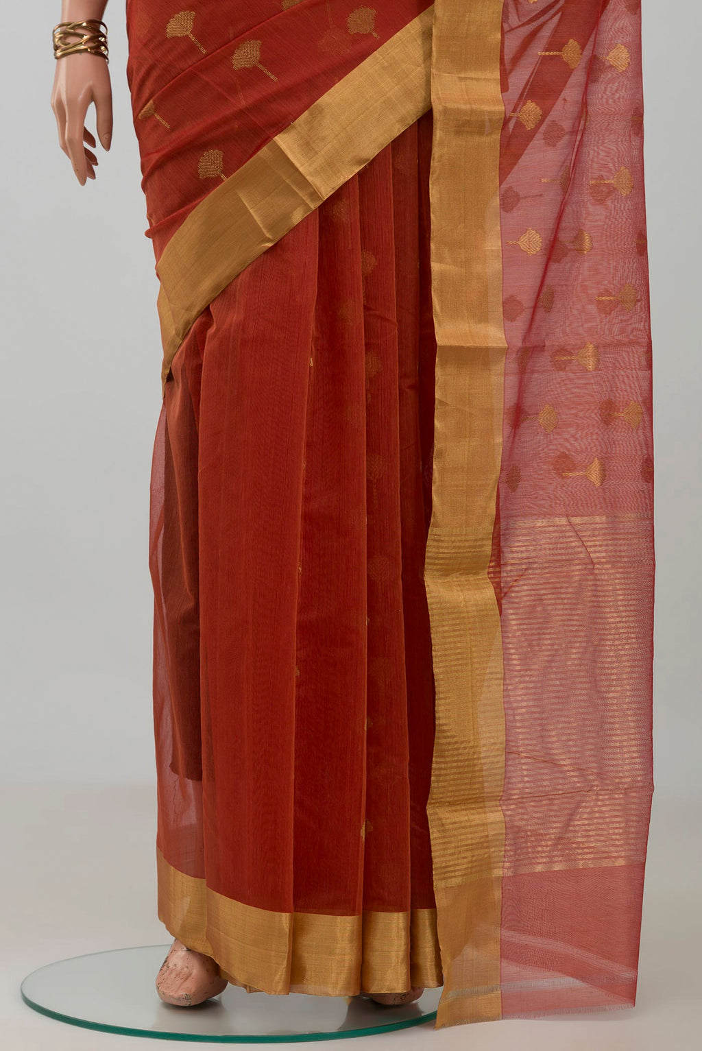 Pleats and pallu of Rust Chanderi Silk Cotton Saree with Zari Butta on the body and Zari Border. 