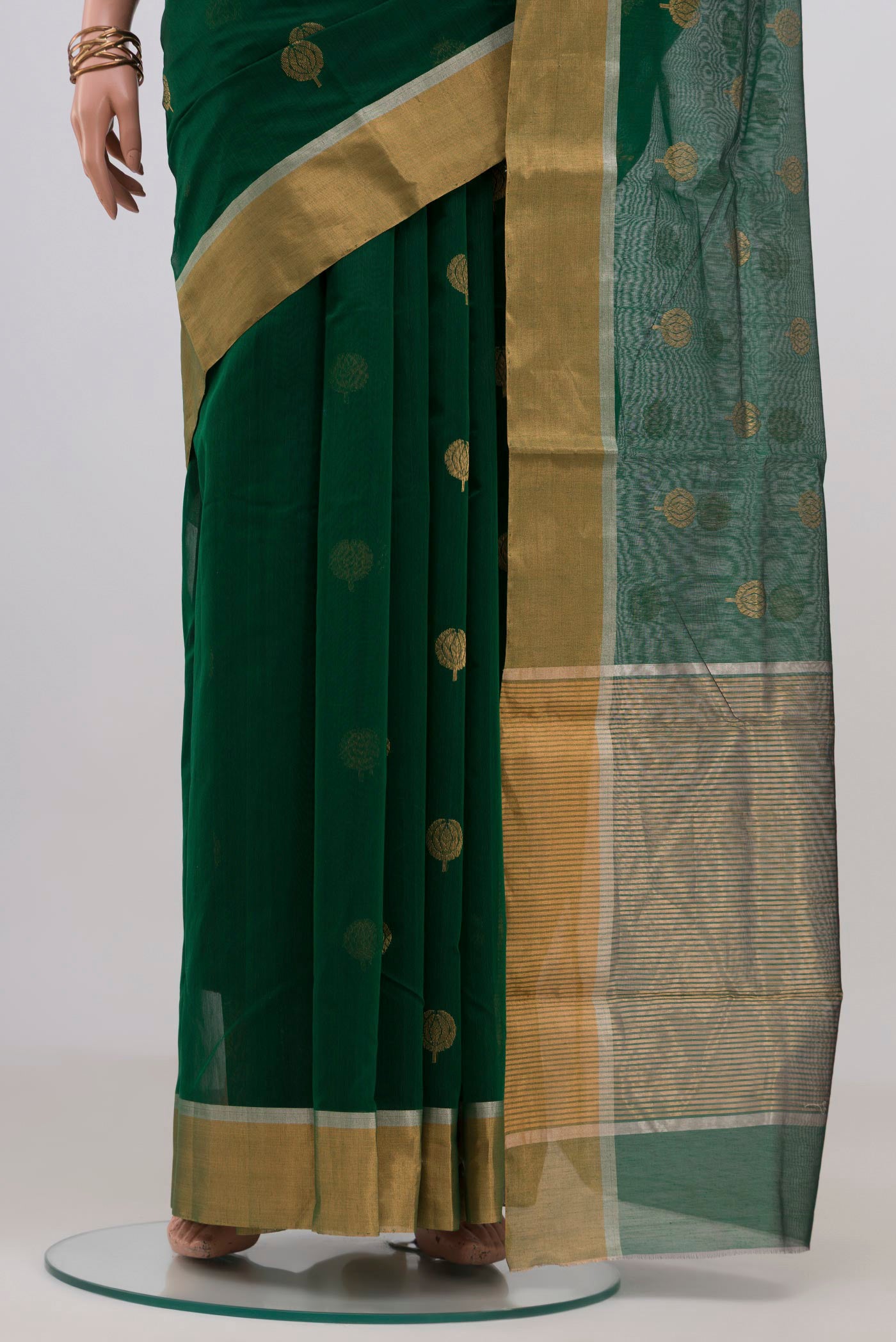 Pleats and pallu of Bottle Green Chanderi Silk Cotton Saree with Zari Butta on the body and Zari Border. 