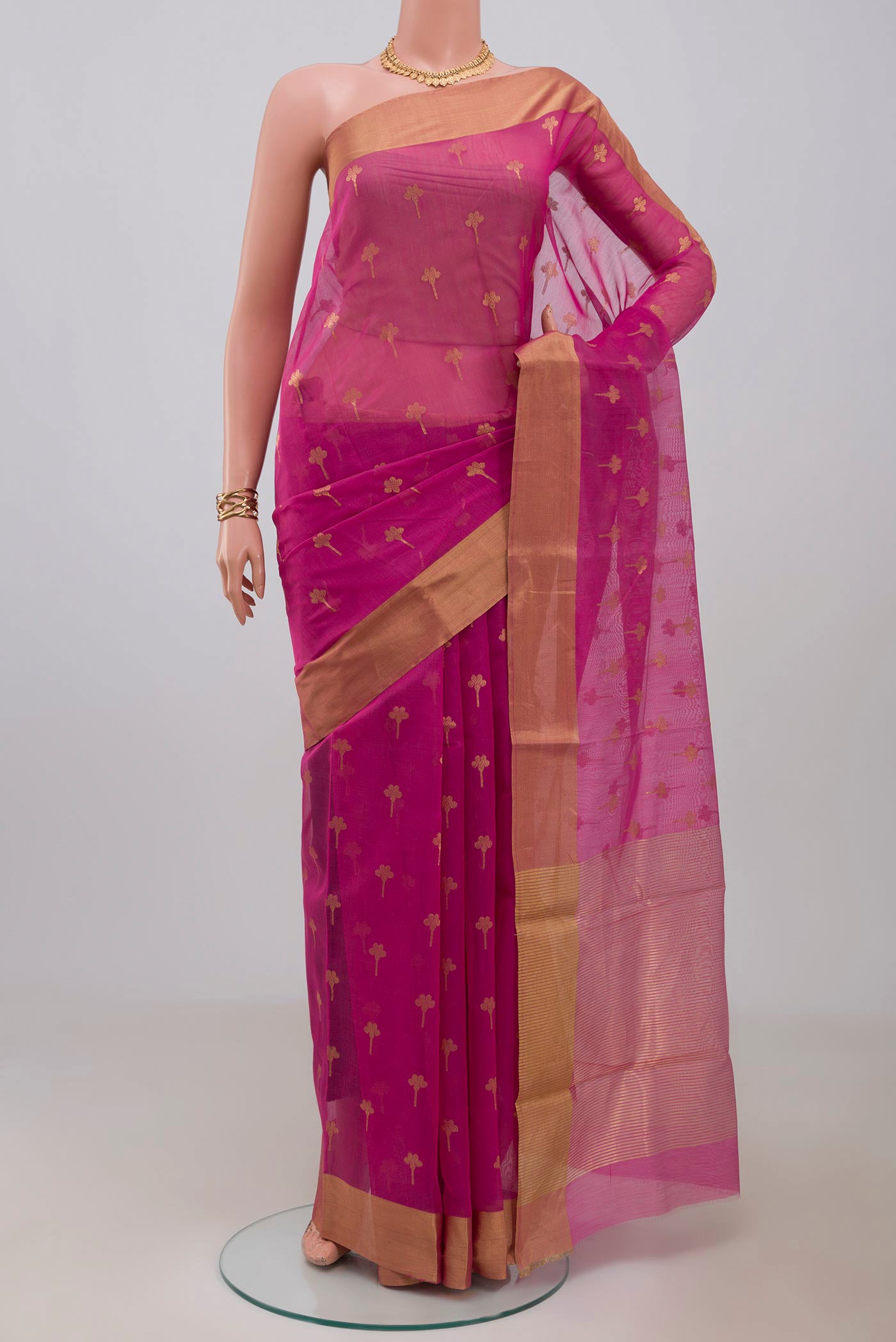 Pink Chanderi Silk Cotton Saree with Zari Butta on the body and Zari Border.  displayed on a mannequin