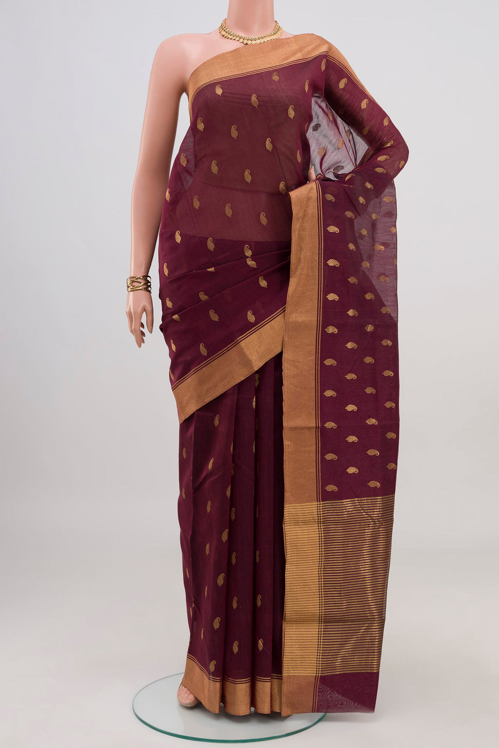 Brown Chanderi Silk Cotton Saree with Zari Butta on the body and Zari Border.  displayed on a mannequin