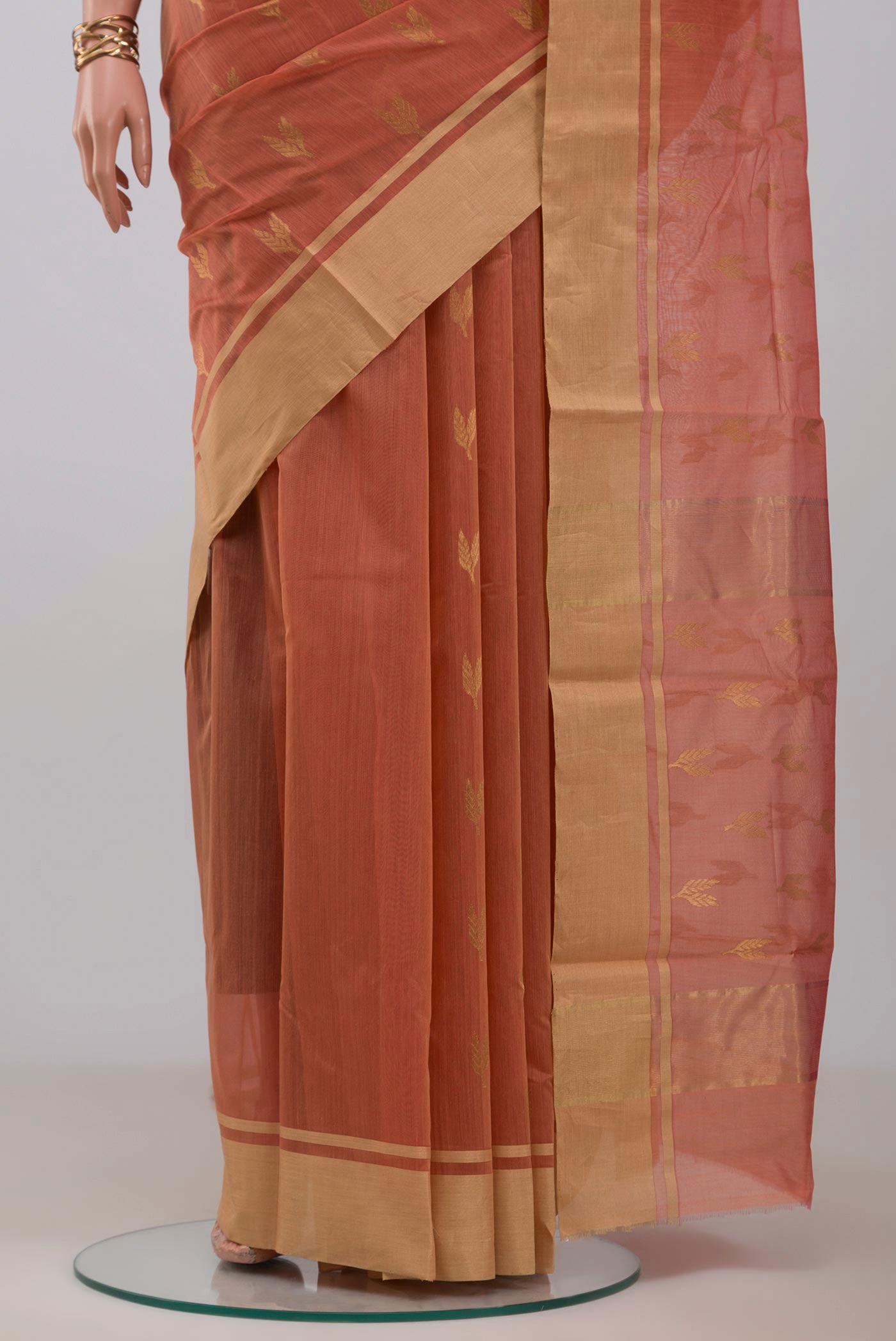 Pleats and pallu of Peach Chanderi Silk Cotton Saree with Zari Butta on the body and Zari Border. 