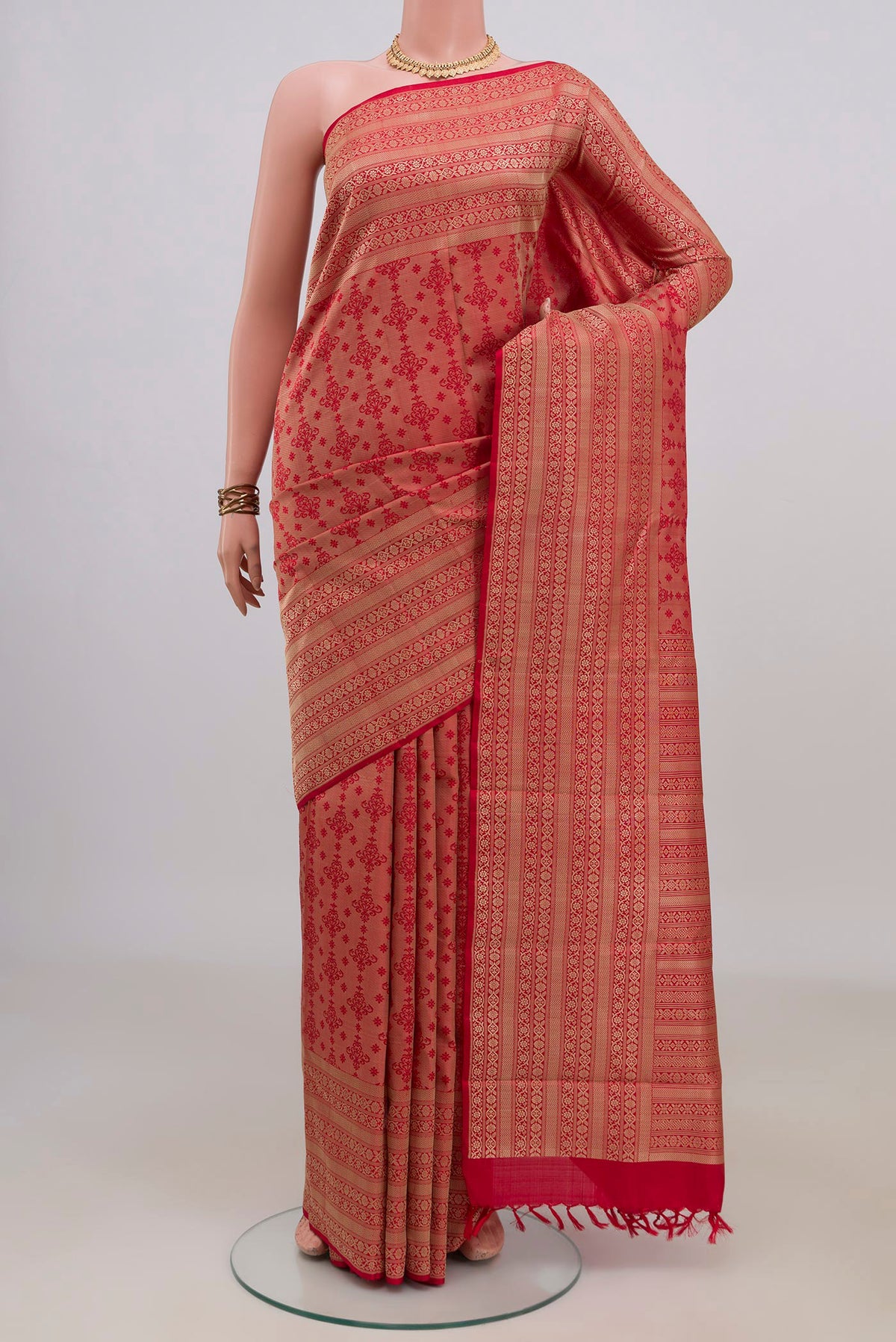 Pure Silk Red Kanchipuram Saree with Jacquard design on the body and Thread Border.  displayed on a mannequin