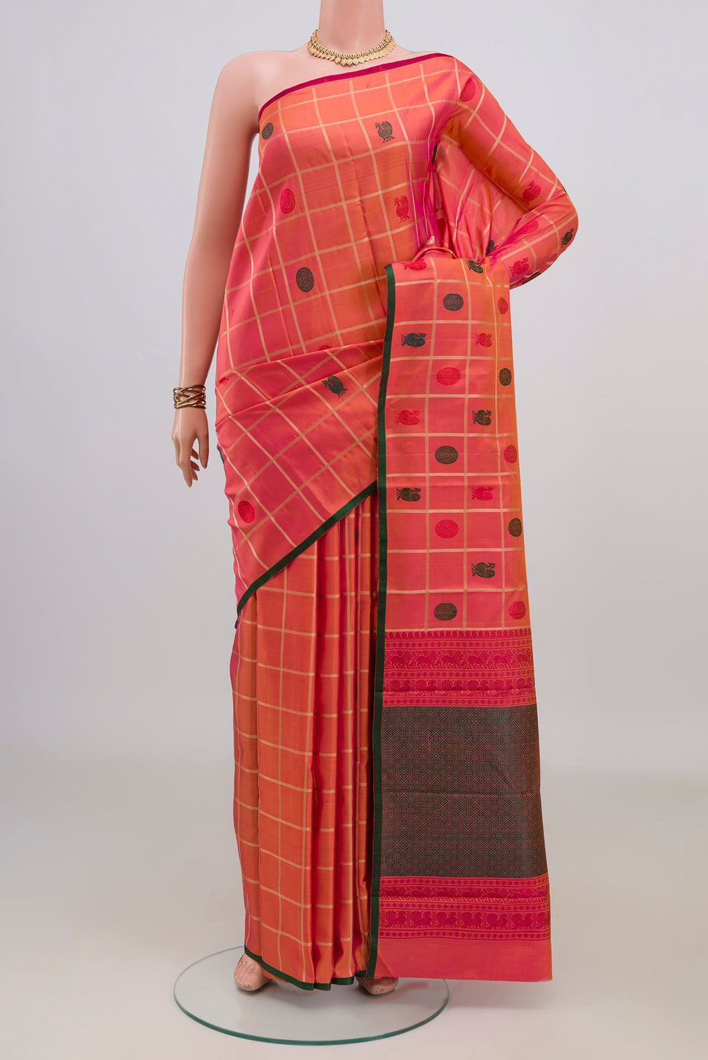 Pure Silk Orange Kanchipuram Saree with Checked design on the body and Without Border.  displayed on a mannequin