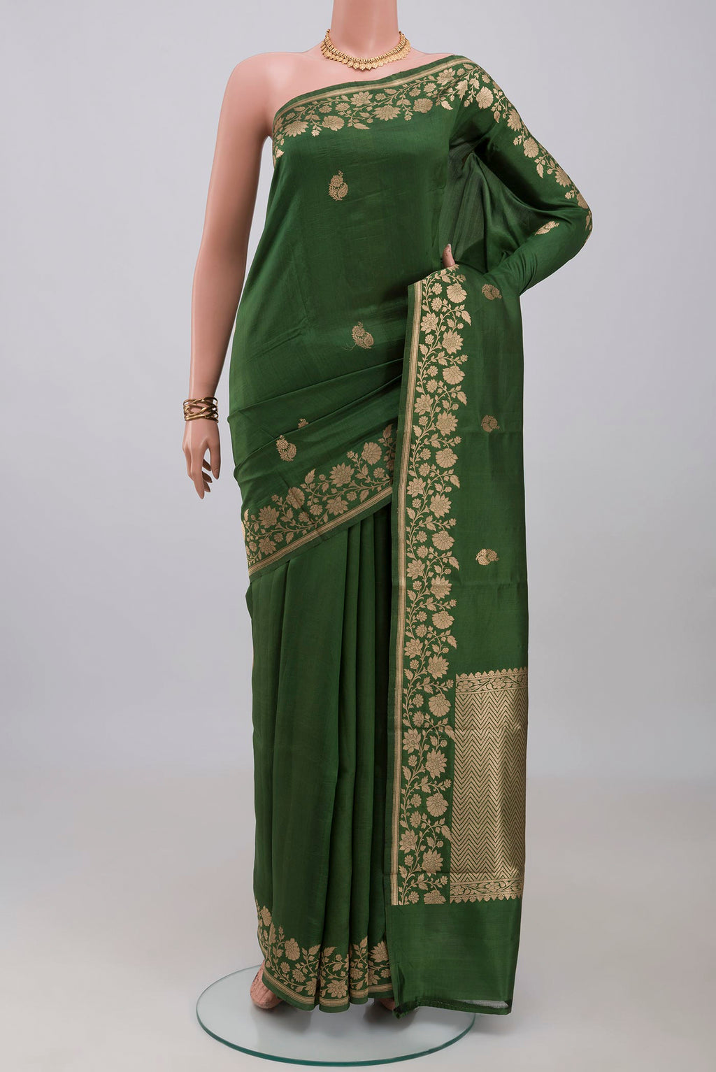 Green Banarasi Katan Silk Saree with Zari Butta on the body and Fancy Border.  displayed on a mannequin